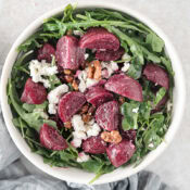 one serving of roasted beet and feta salad with walnuts and arugula
