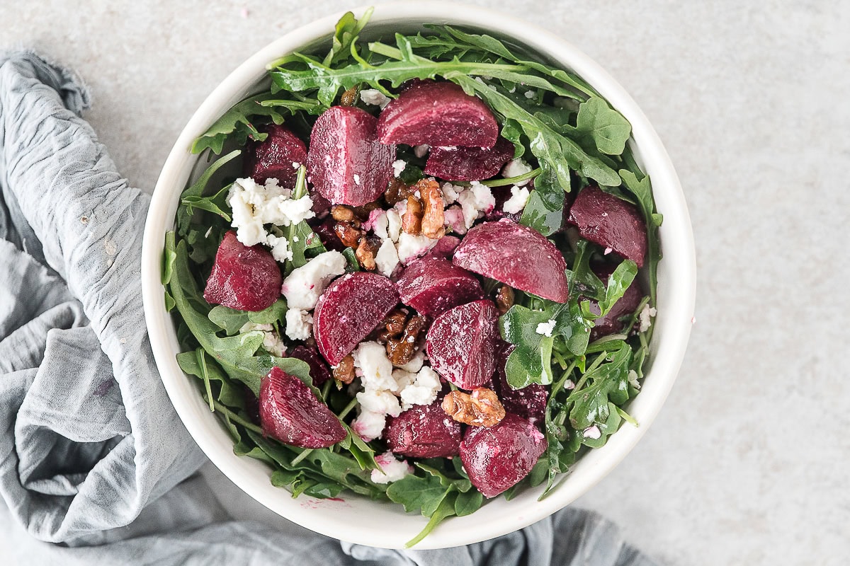 one serving of roasted beet and feta salad with walnuts and arugula