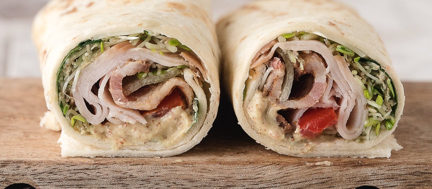a warm turkey bacon wrap cut in half