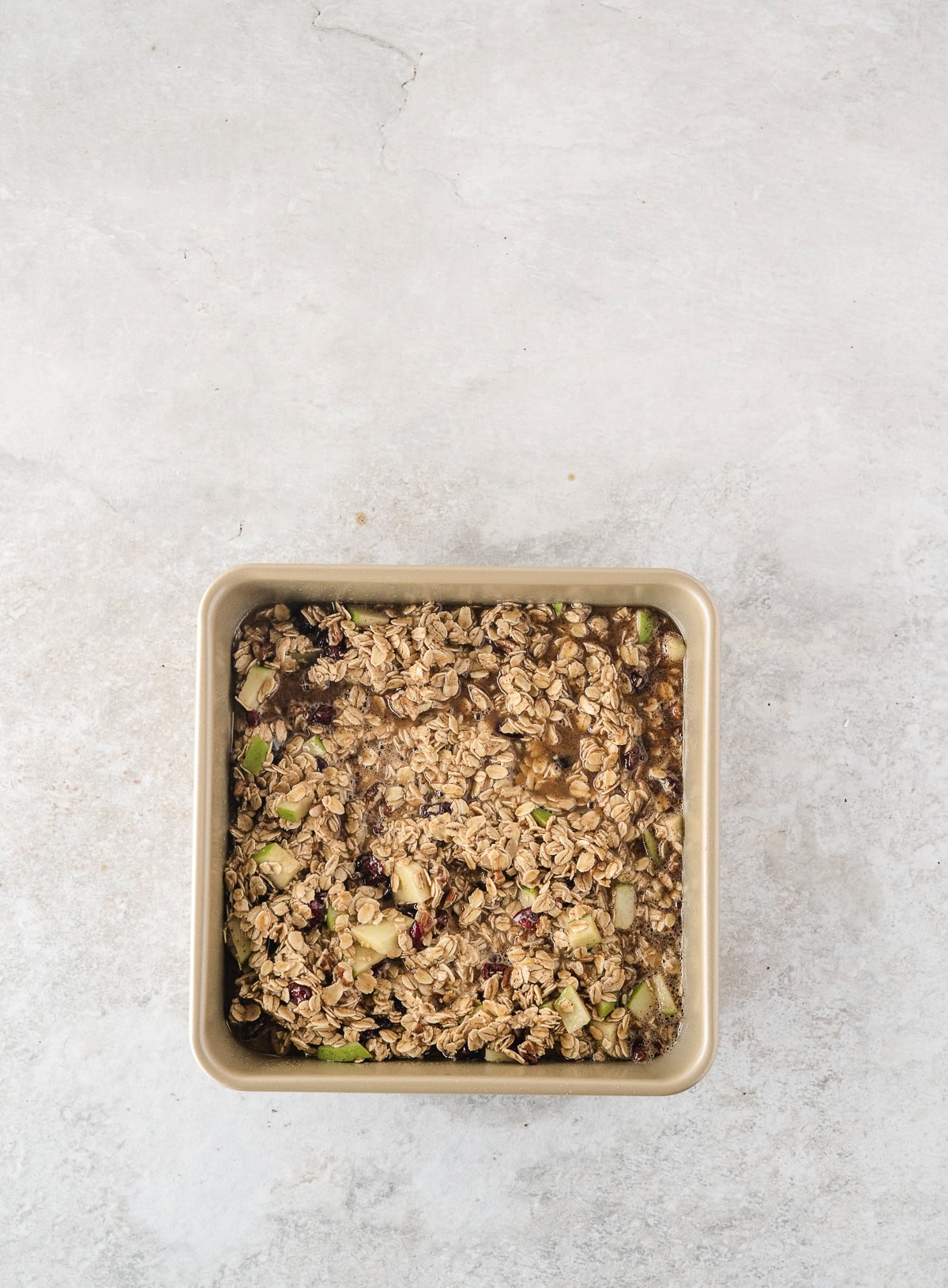 pour the oatmeal and fruit mixture into the prepared baking dish