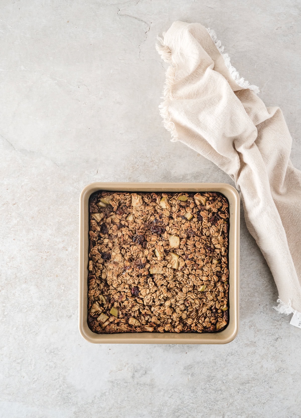 bake the oatmeal casserole in the oven until it is lightly golden brown on top