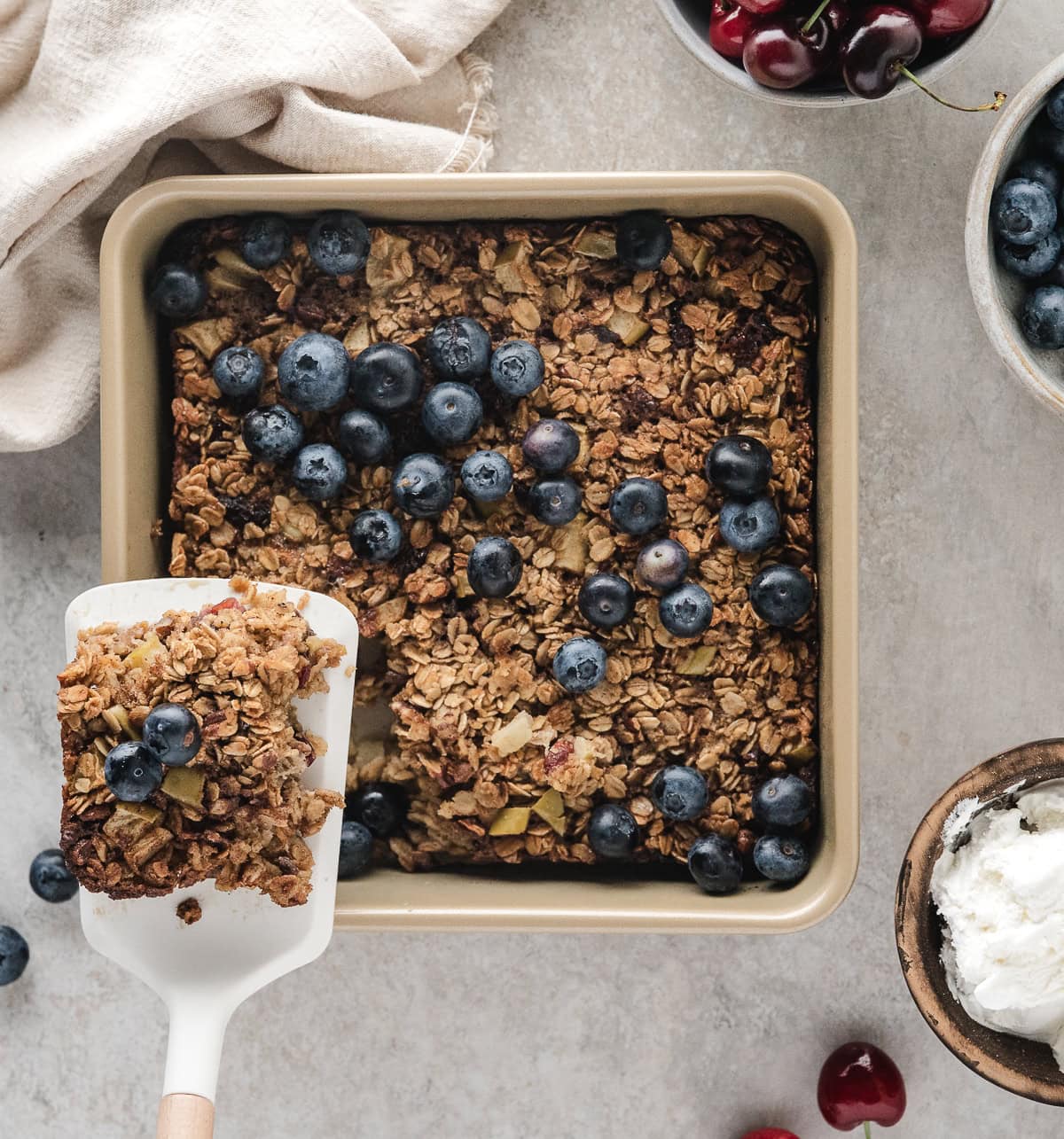 healthy baked oatmeal with blueberry, apple, and cherry