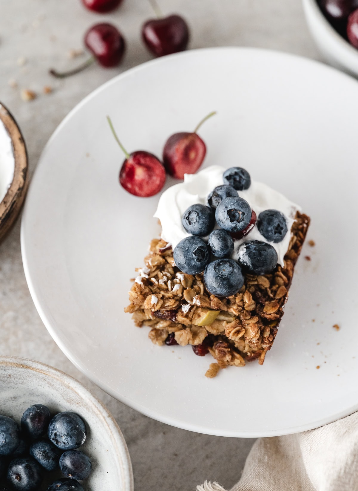baked blueberry oatmeal on a white plate