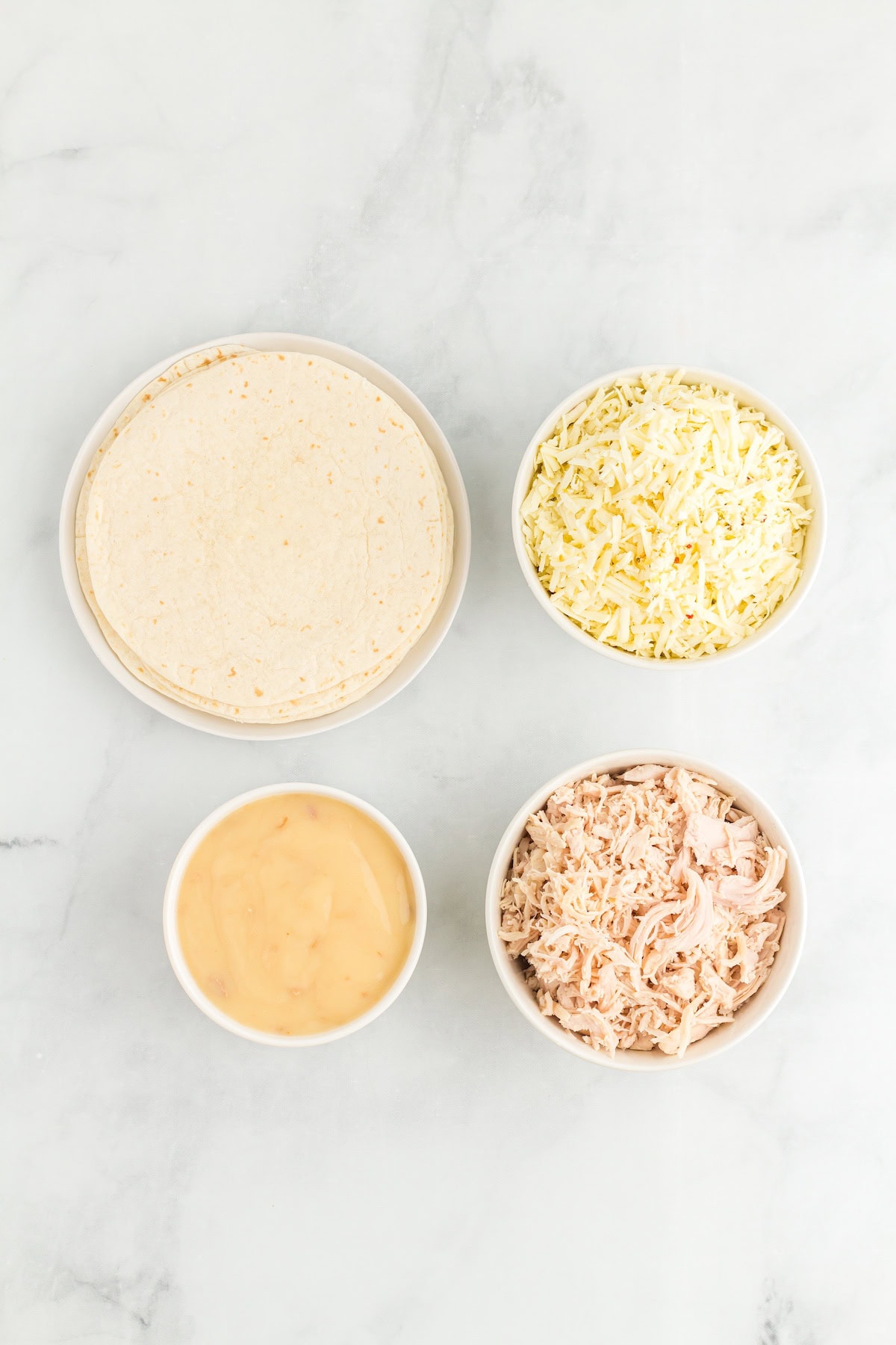 Creamy White Chicken Enchiladas ingredients including Cream of Chicken Soup