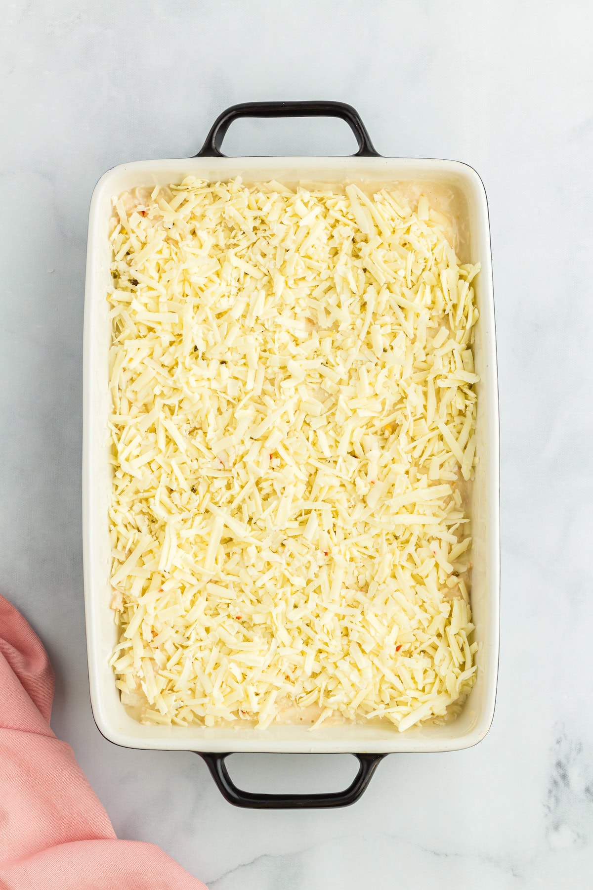 top the enchiladas with shredded cheese