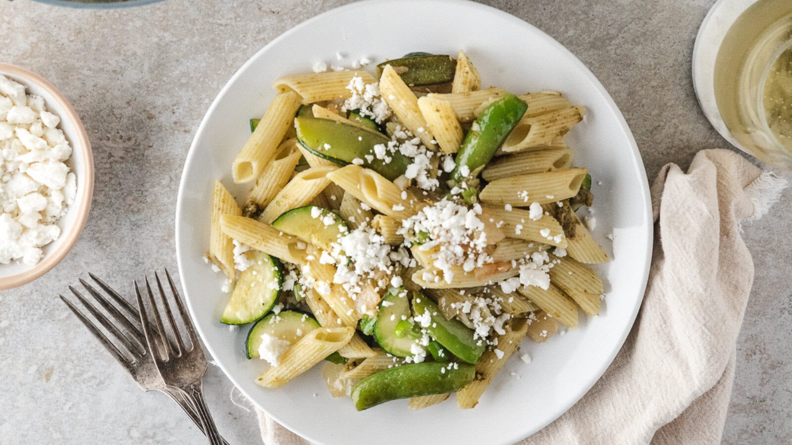 easy pasta primavera on a white plate with forks
