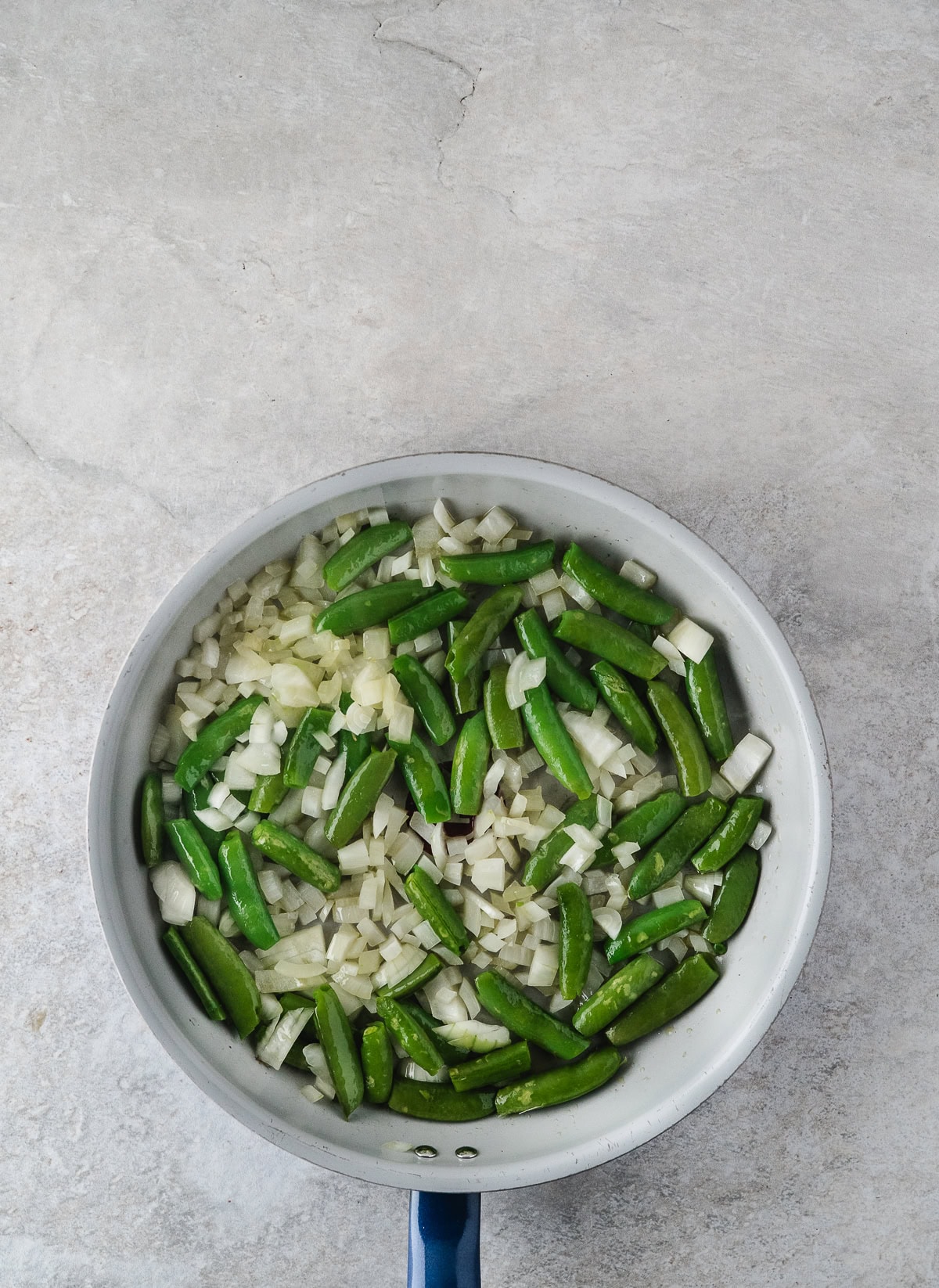 sauté the onions and peas in olive oil