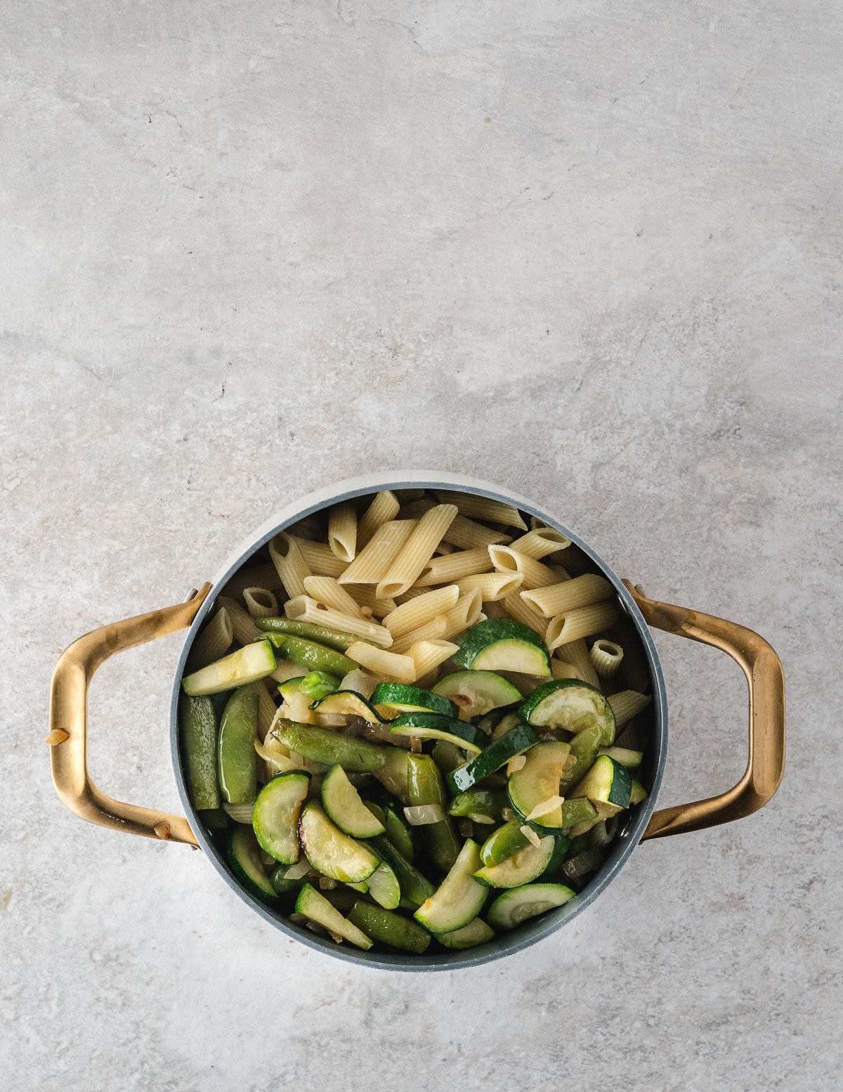 add the vegetables to the pasta in the pot