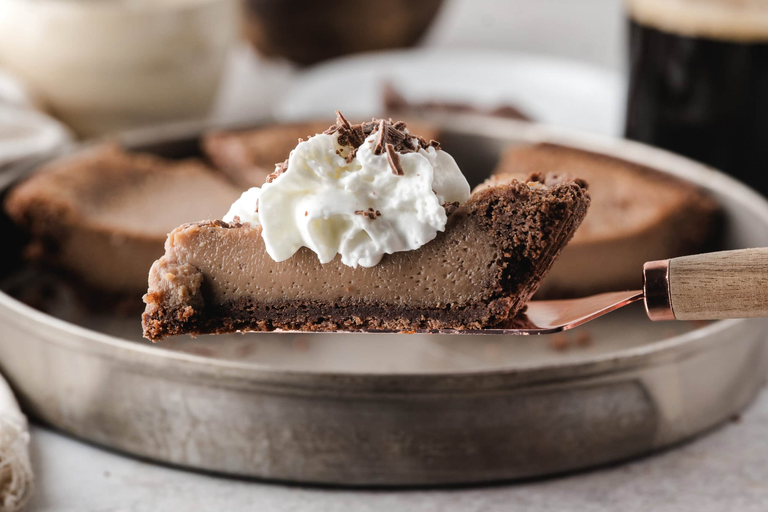 one slice of homemade chocolate pie on a serving spatula