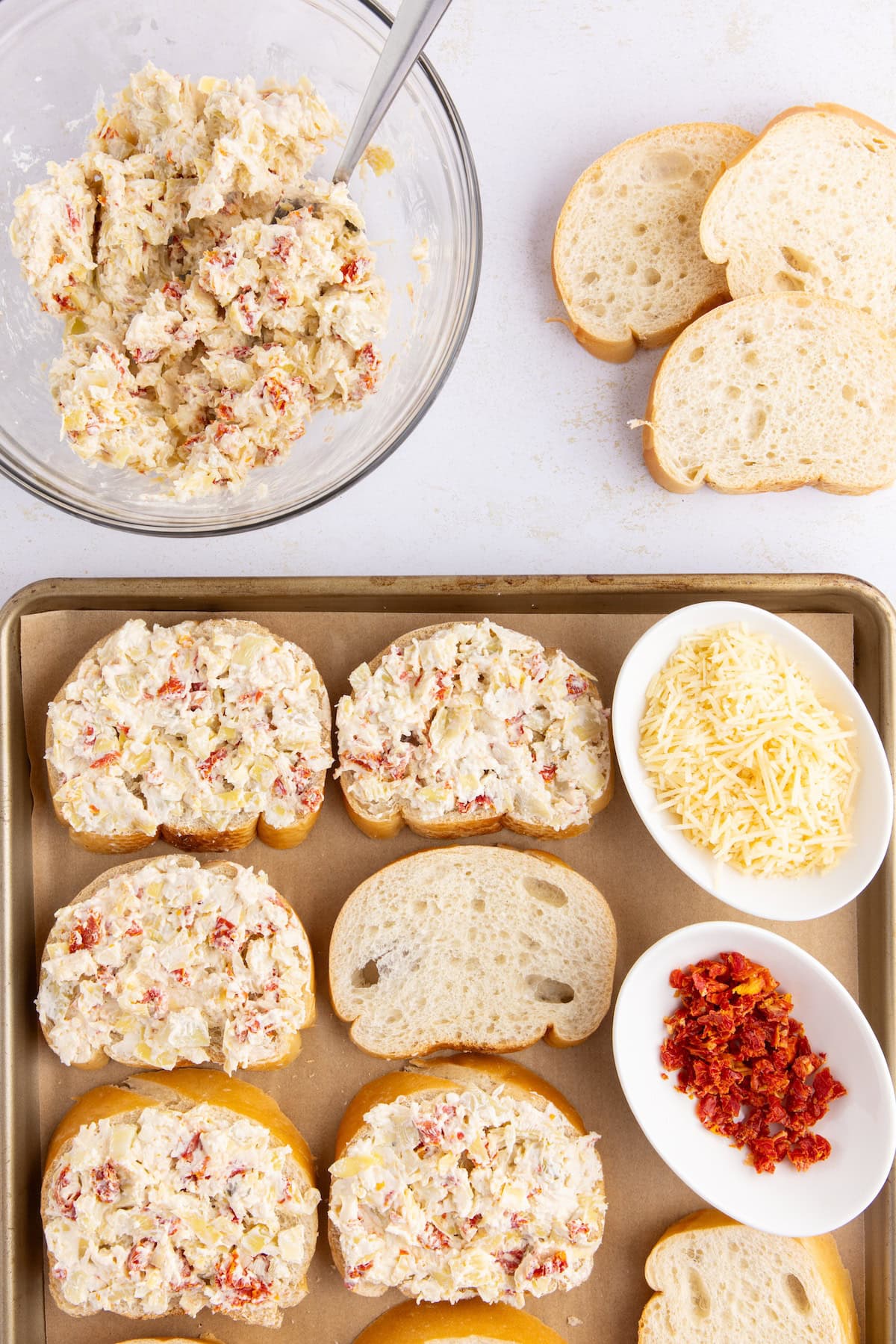 spread the artichoke mixture on the bread slices