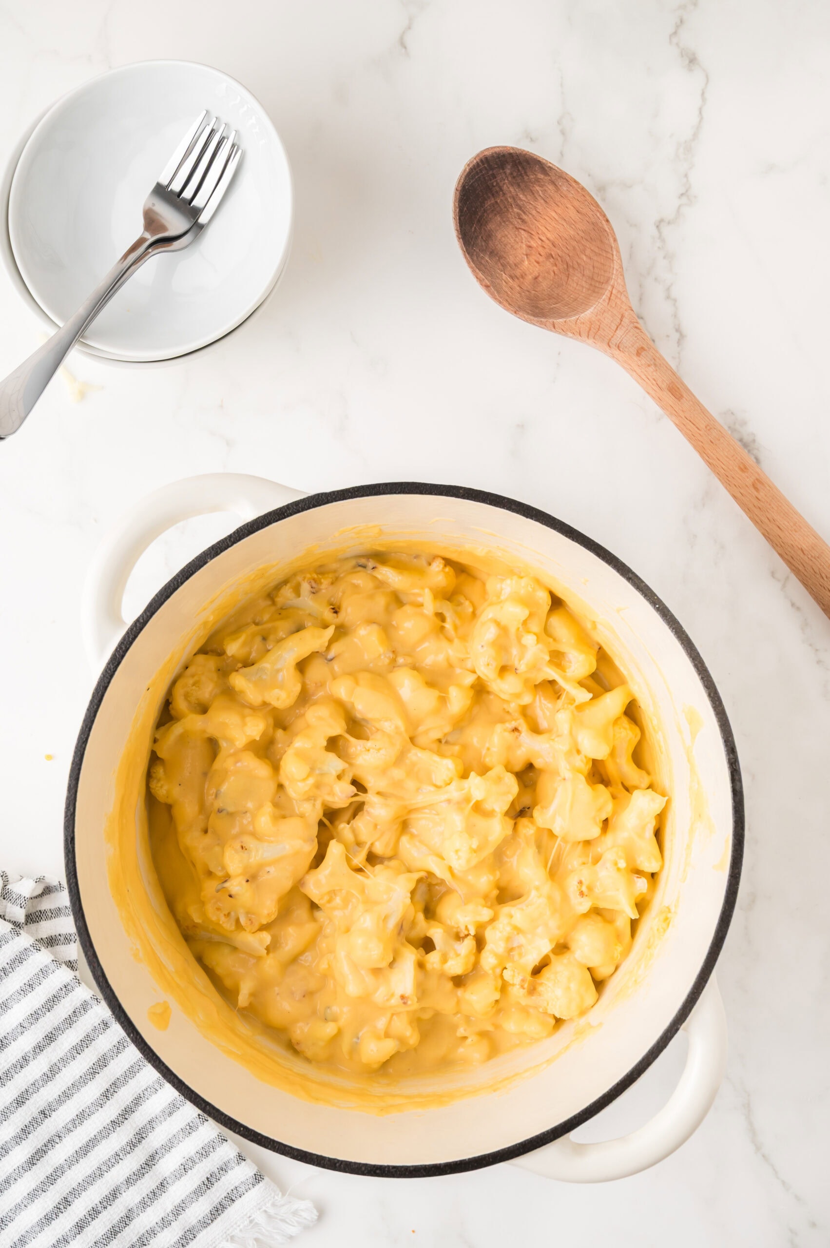 The cauliflower is all mixed in with the homemade cheese sauce ready to be served.