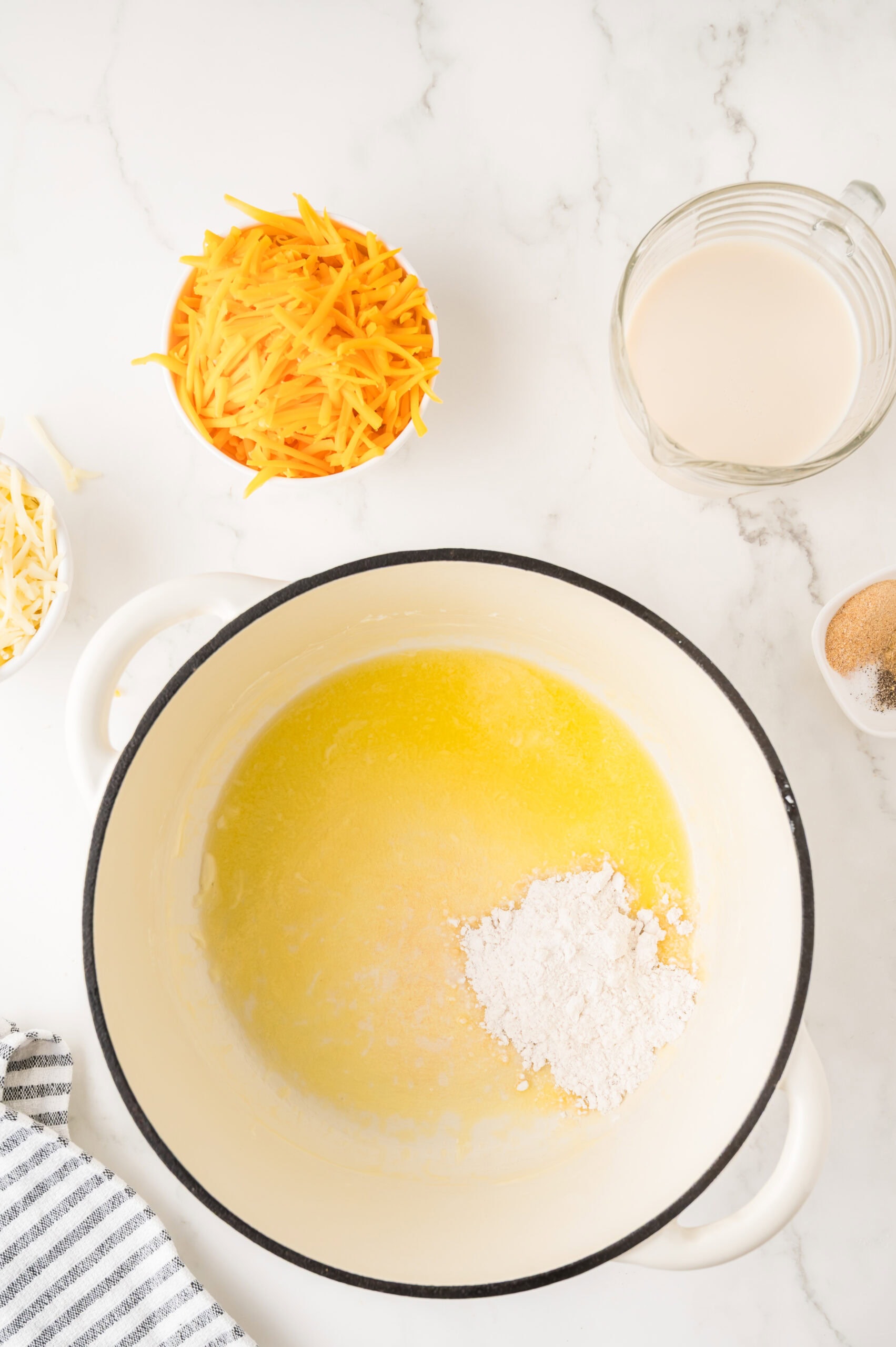 Melting butter with added flour to start to create the cheese sauce for the mac & cheese