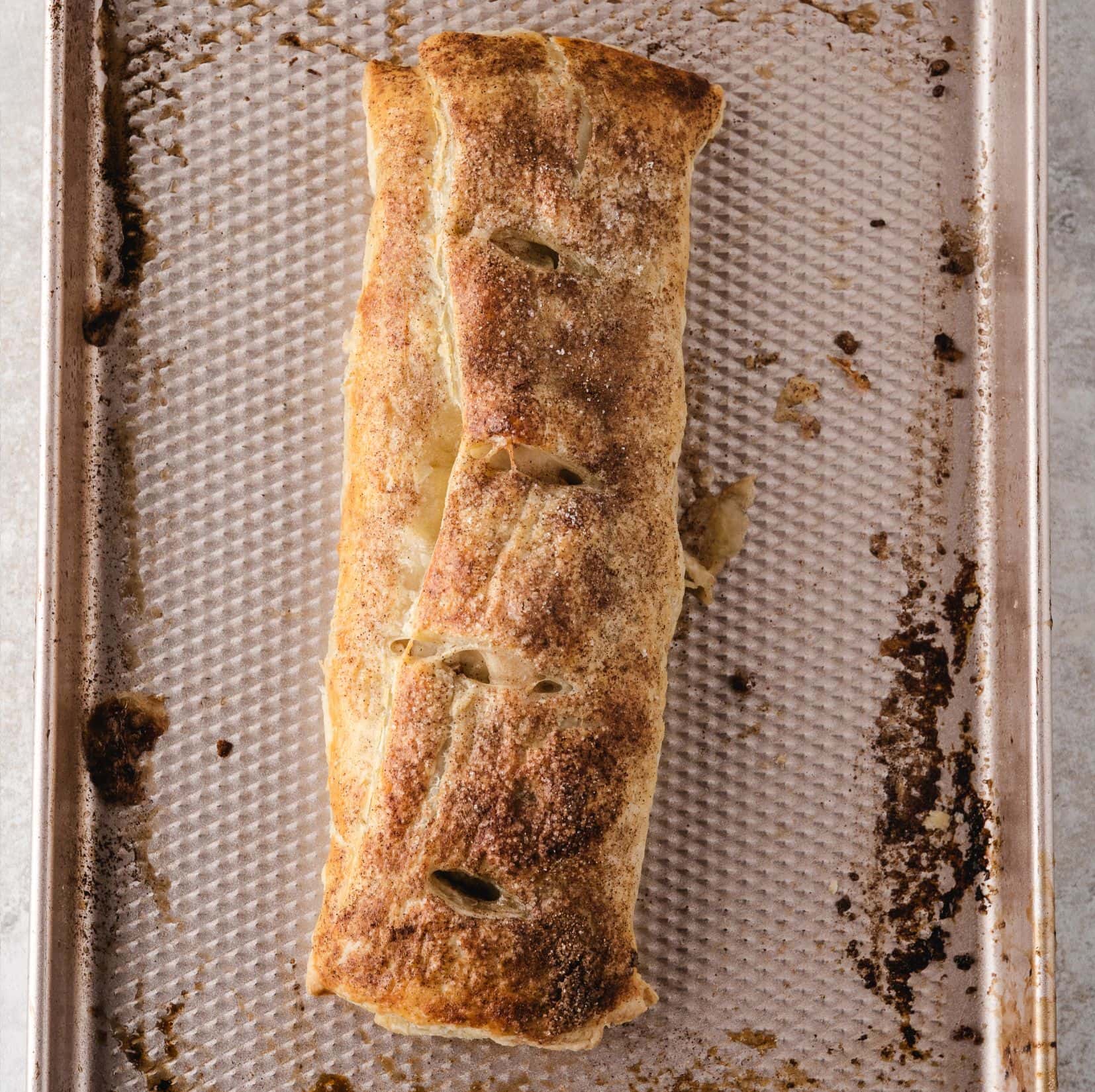 Apple strudel with puff pastry all baked and ready to eat with a golden brown crust