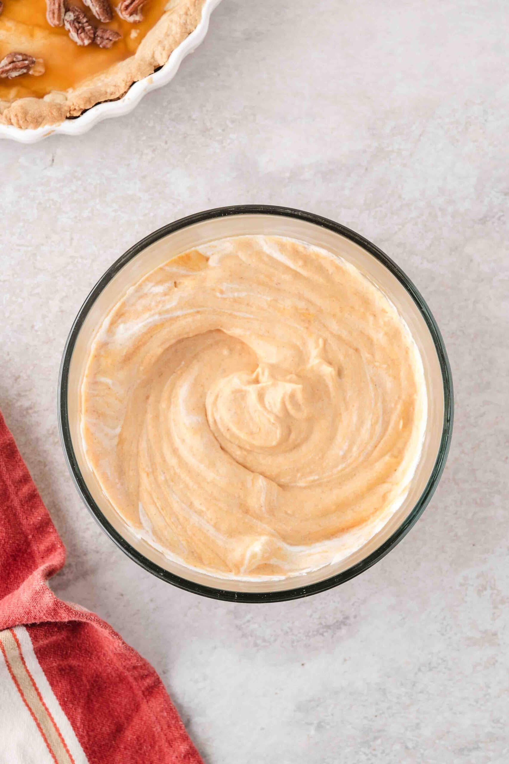 Whip cream mixed into the no bake pumpkin pie mixture ready to put in pie crust