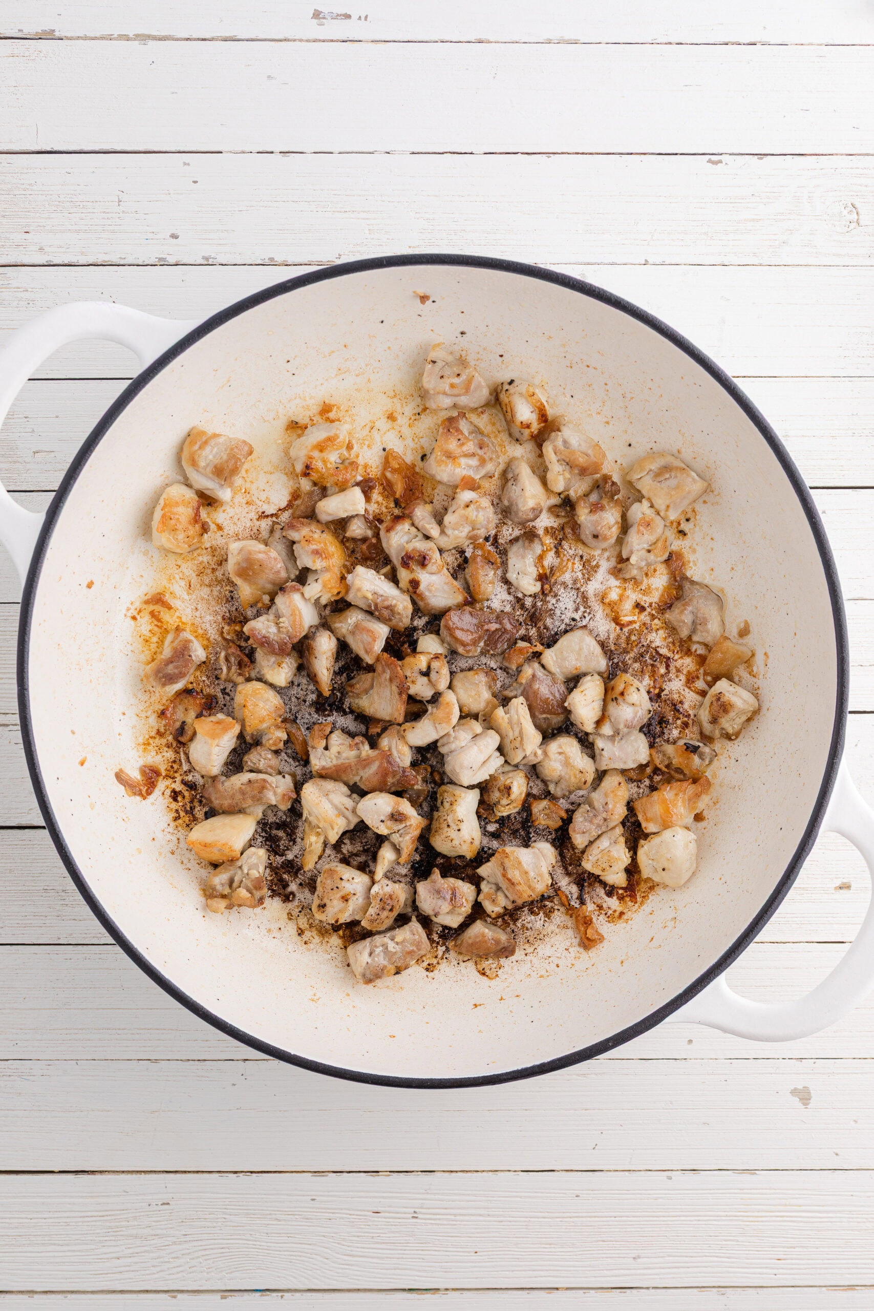brown the chicken thighs in the large pot or skillet