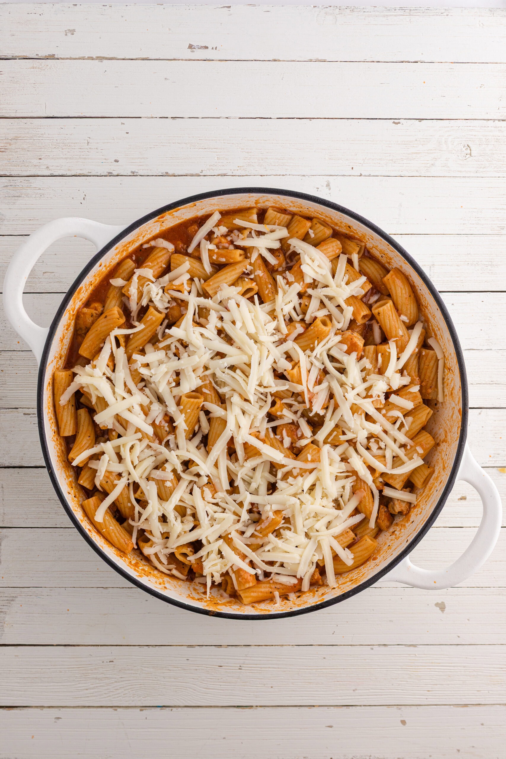 top the pasta with lots of shredded cheese