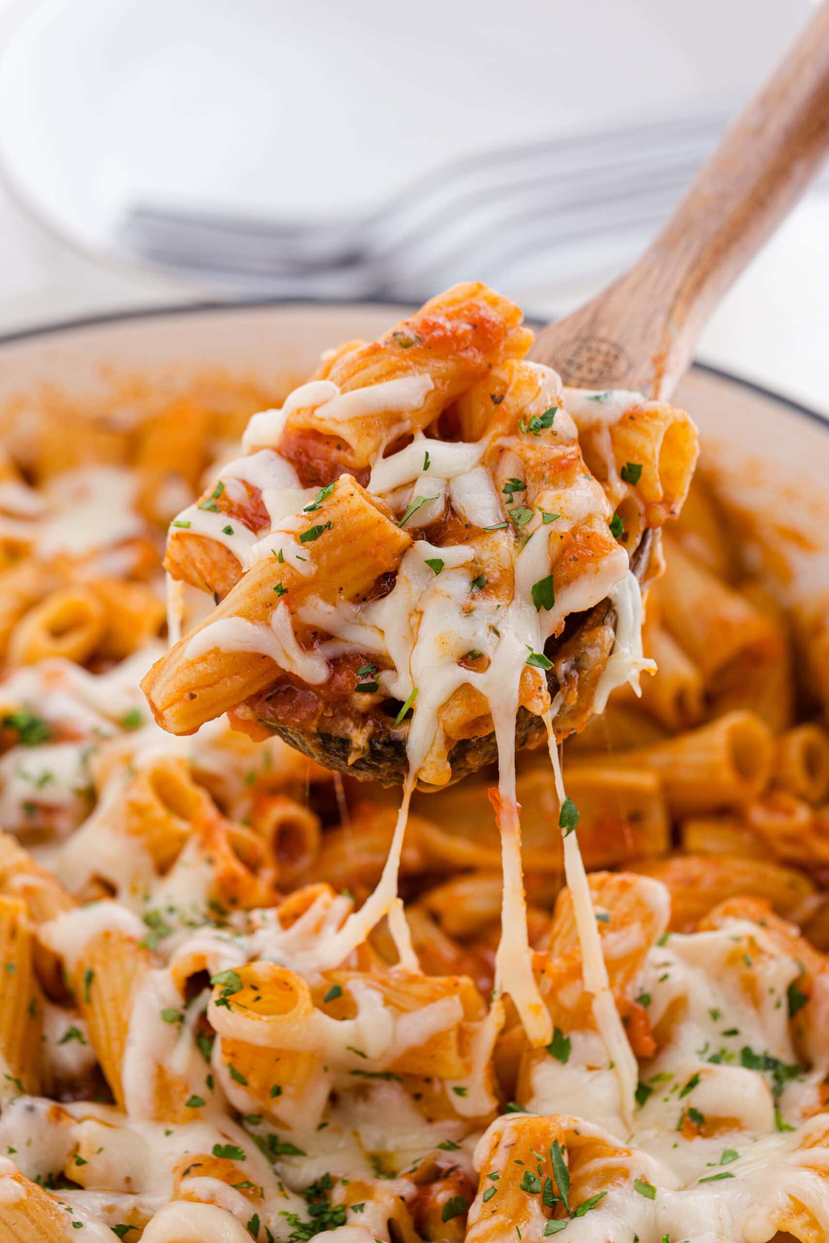 a big spoonful of one pot chicken parmesan pasta recipe with melty cheese
