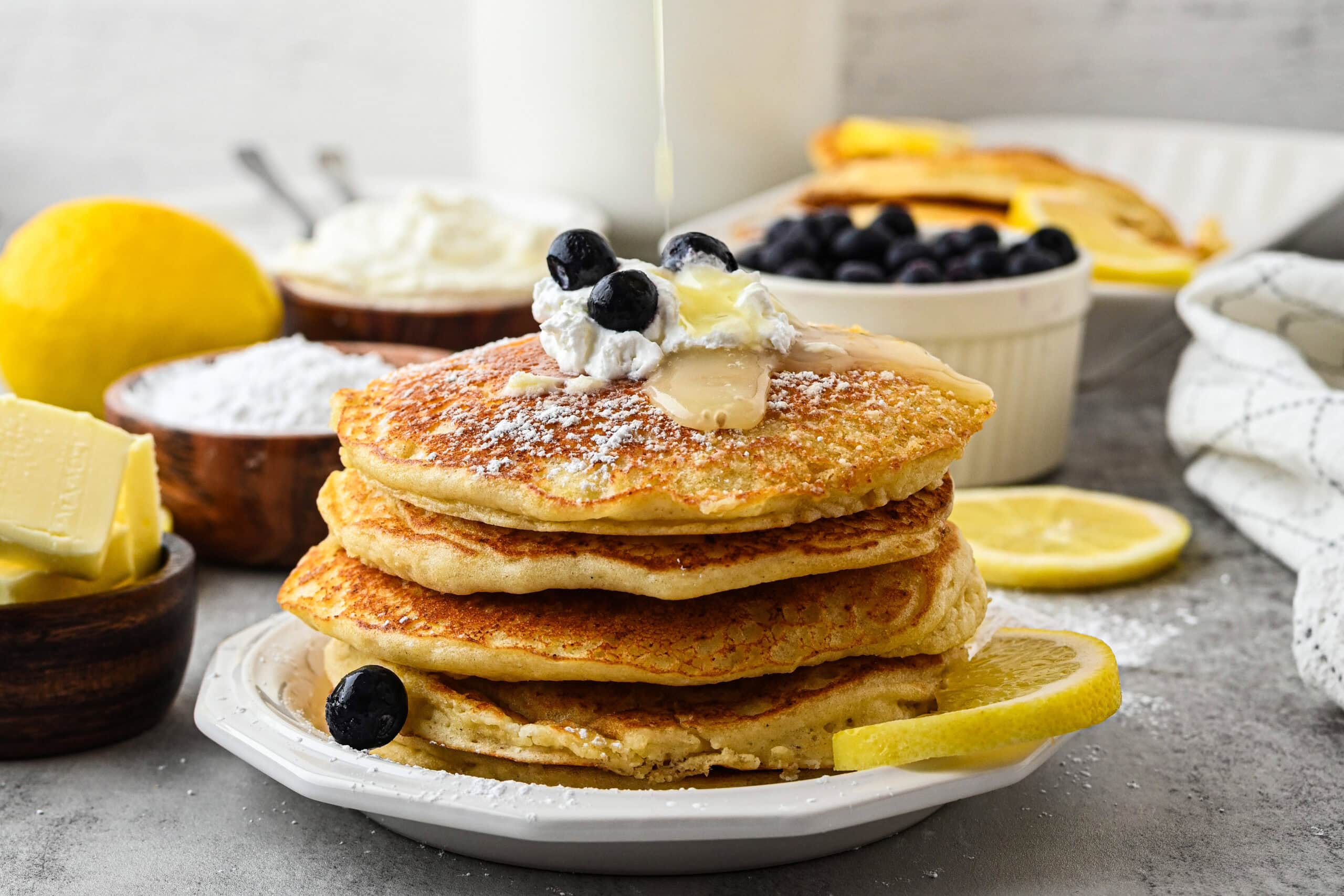 A small stack of Lemon Ricotta pancakes plated and ready to be enjoyed
