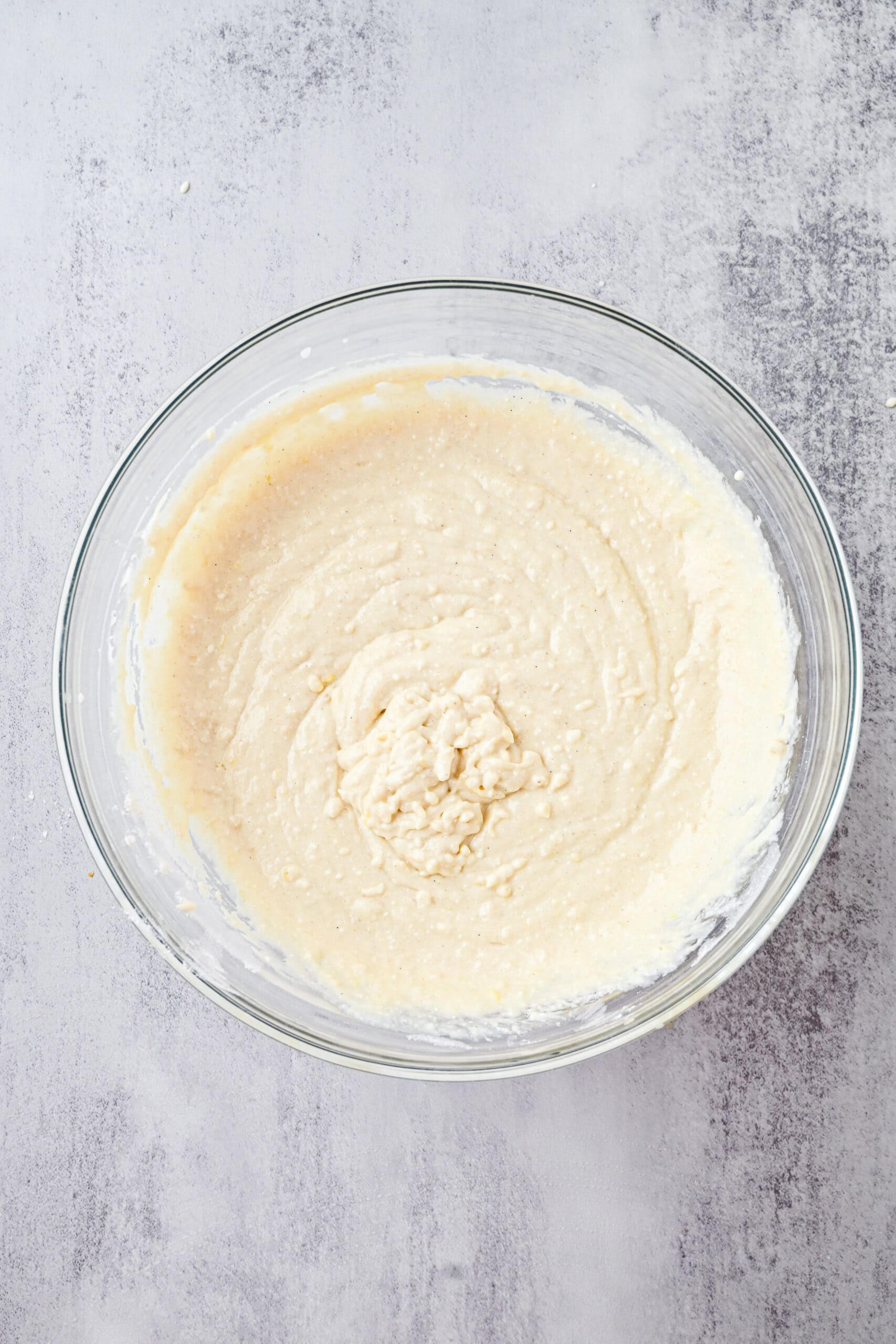 The wet and dry ingredients are whisked all together to create the batter of lemon ricotta pancakes