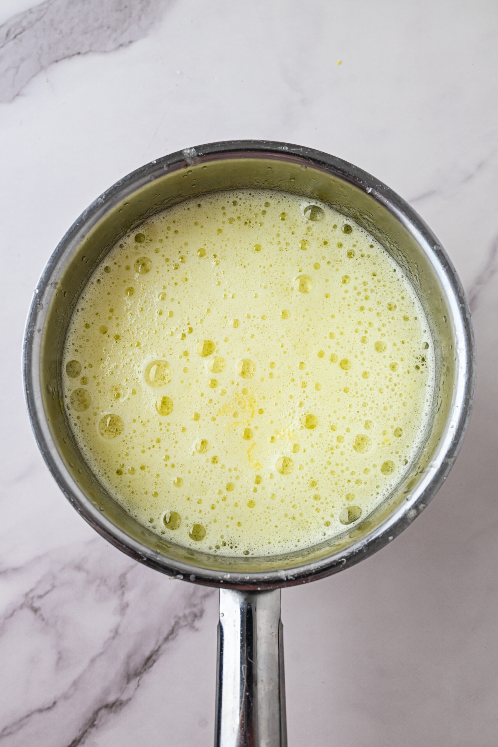 Lemon syrup with added baking soda , low simmer, finishing the recpe