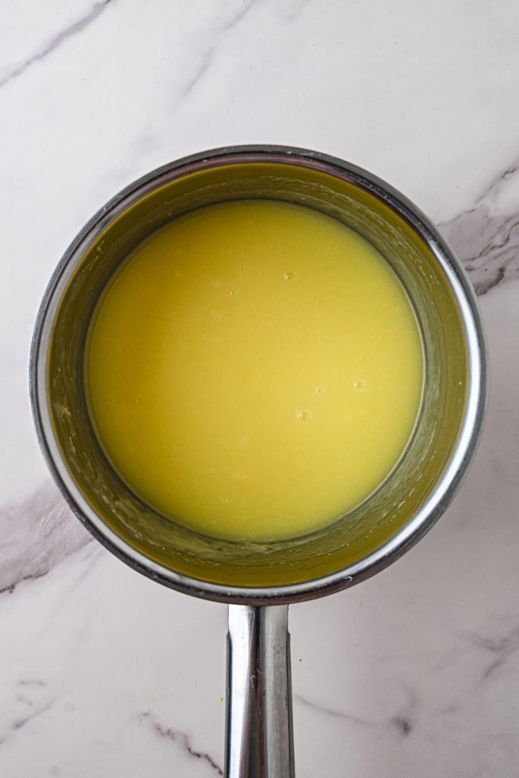 Lemon sauce being cooled after simmer it to complete the recipe