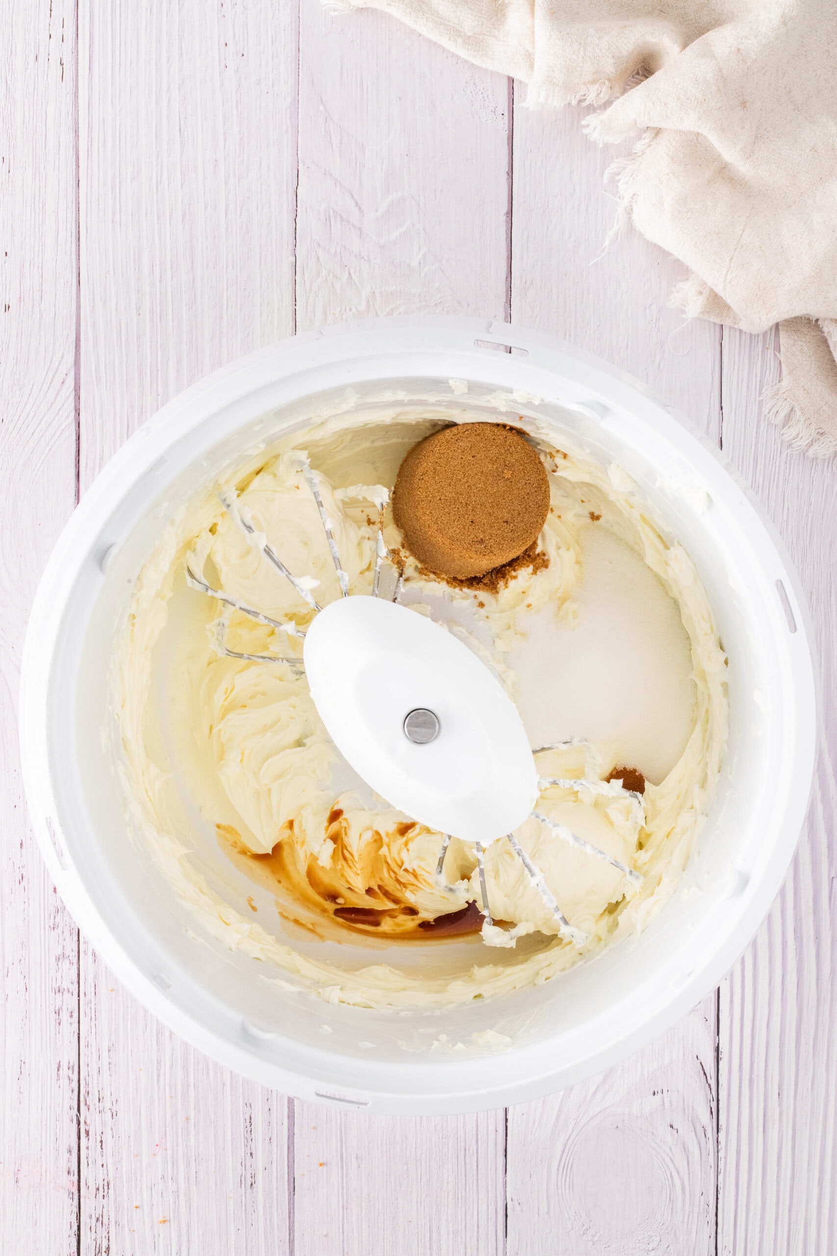 Cream cheese, yogurt, eggs, vanilla, sugar added into mixing bowl to create the cheesecake part of the pecan mini cheesecakes