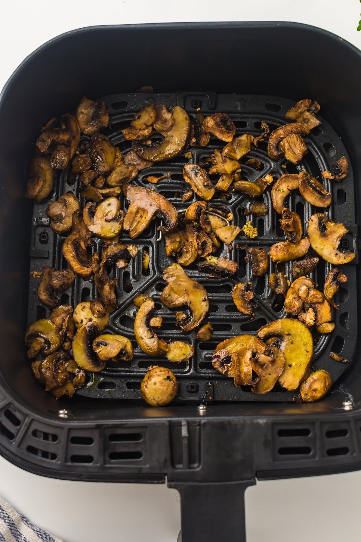 air fried mushrooms in the air fryer basket