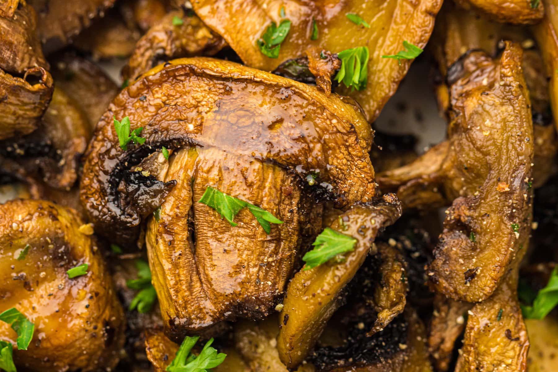 a close up of air fryer garlic mushrooms