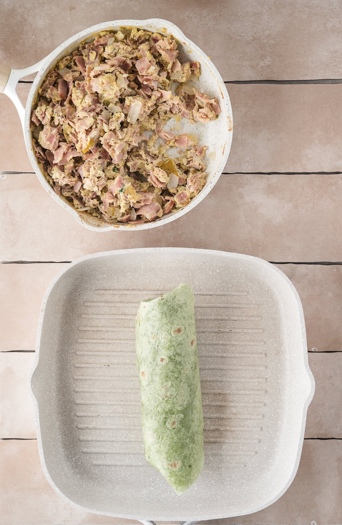 Showing the egg mixture in a pan, next to it is a grill pan that has the egg mixture inside ready to be grilled