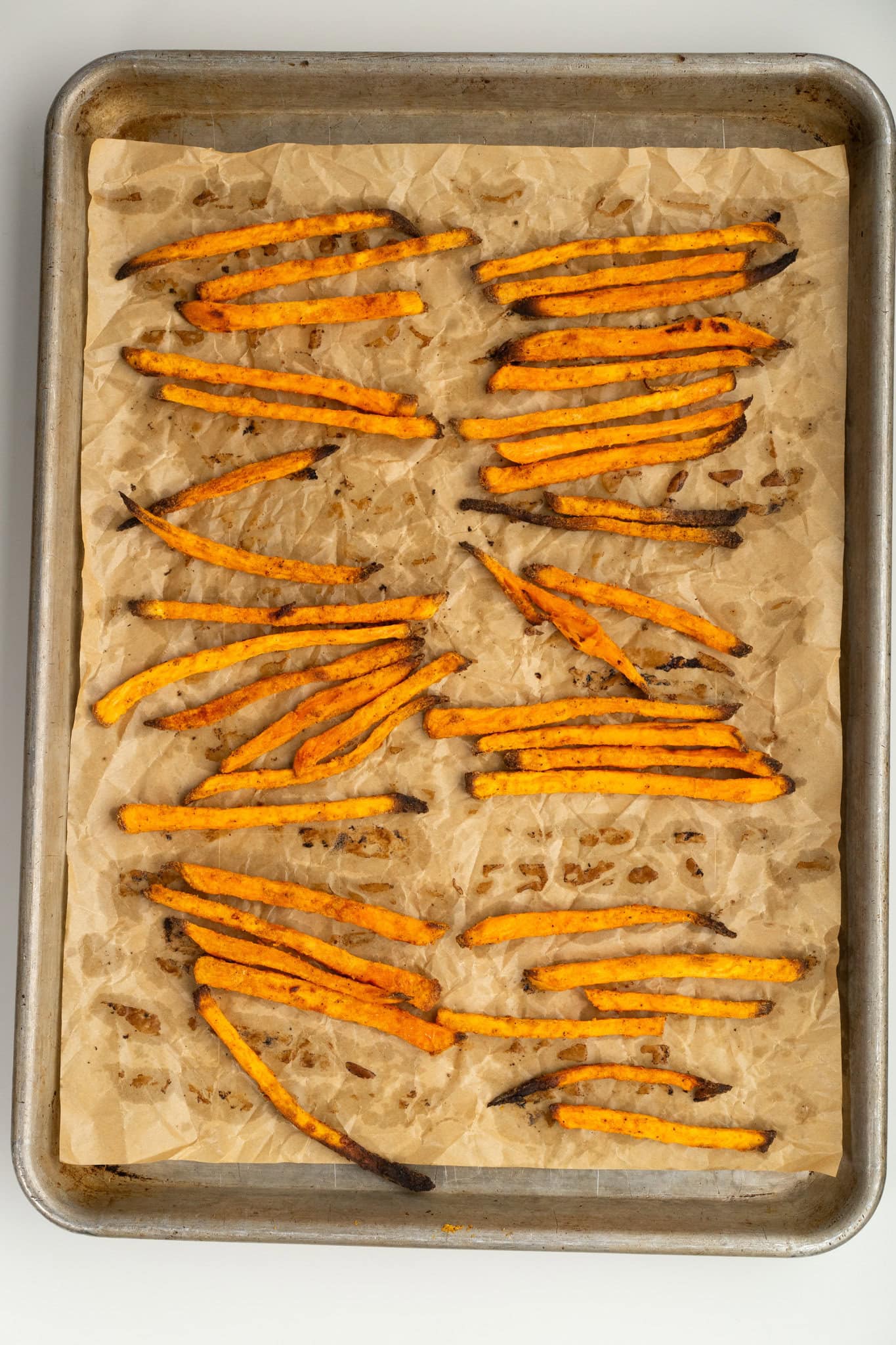 Air Fryer Sweet Potato Fries all fried and laid in baking sheet
