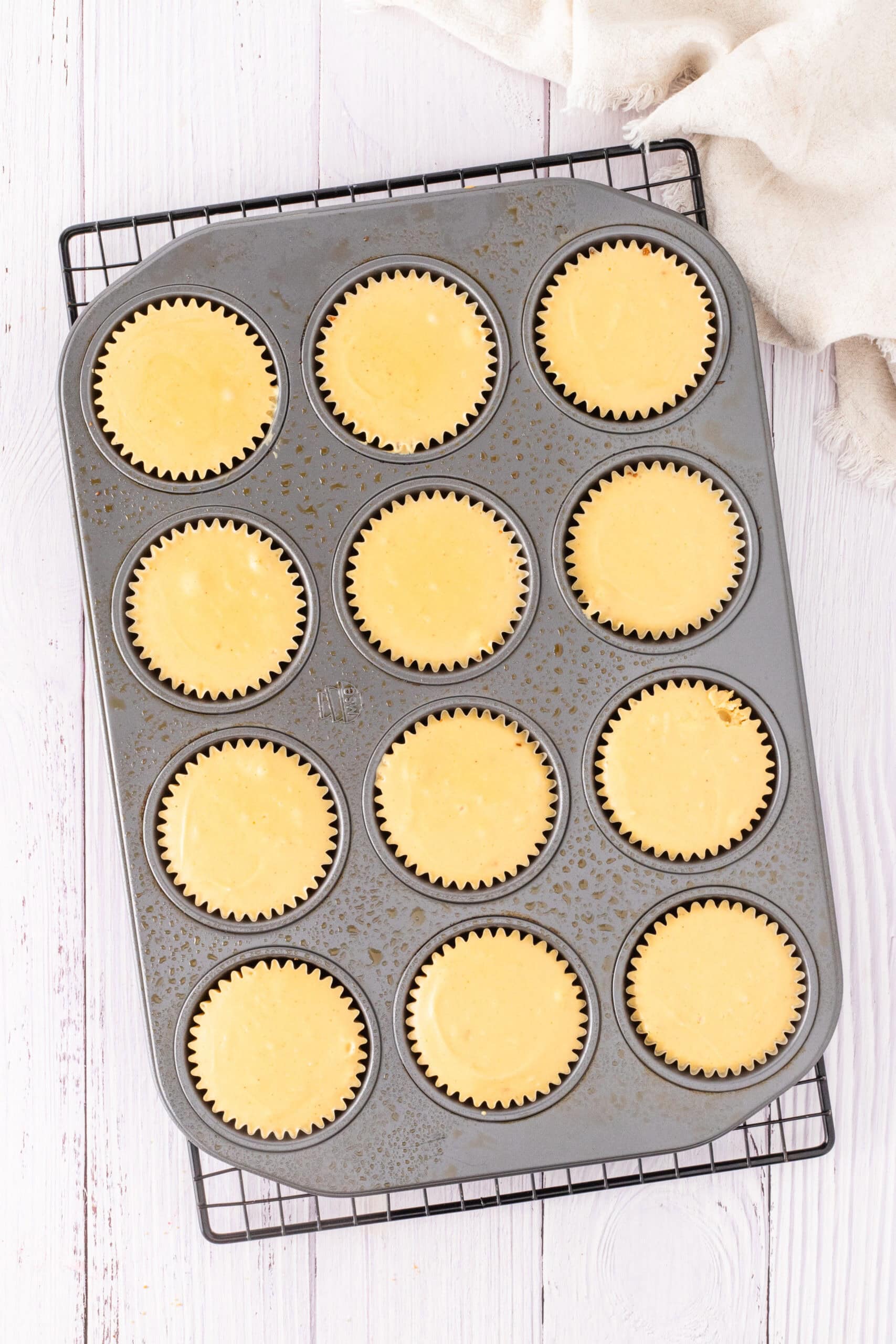 Baked cheesecake layer ready for the pecan topping to go on top as soon as it cools