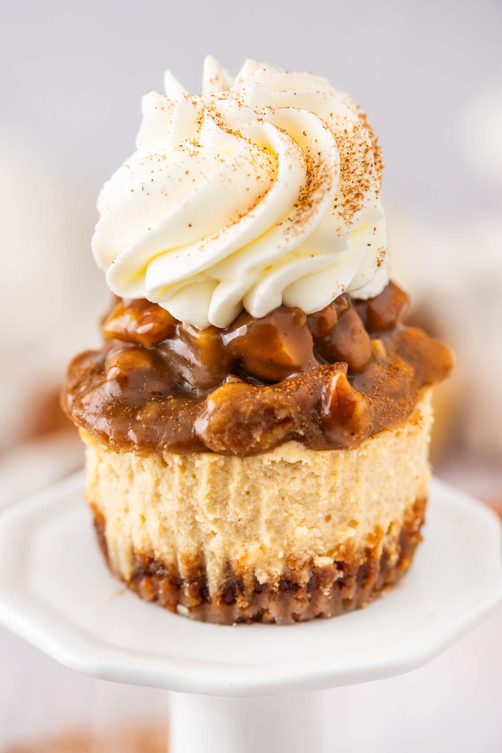 Mini pecan pie cheesecakes are baked and cooled, ready to be enjoyed