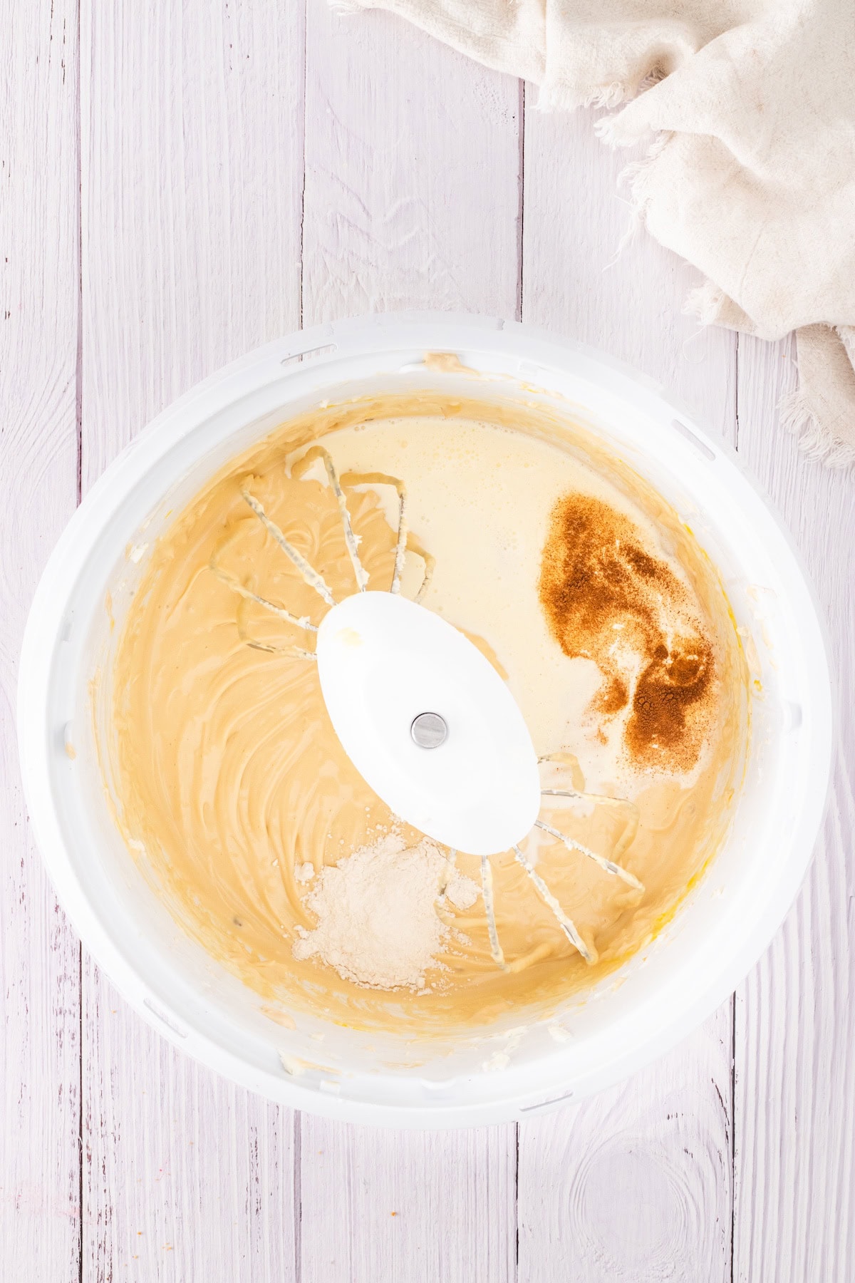 add the cream, vanilla, and flour to the cheesecake mixture