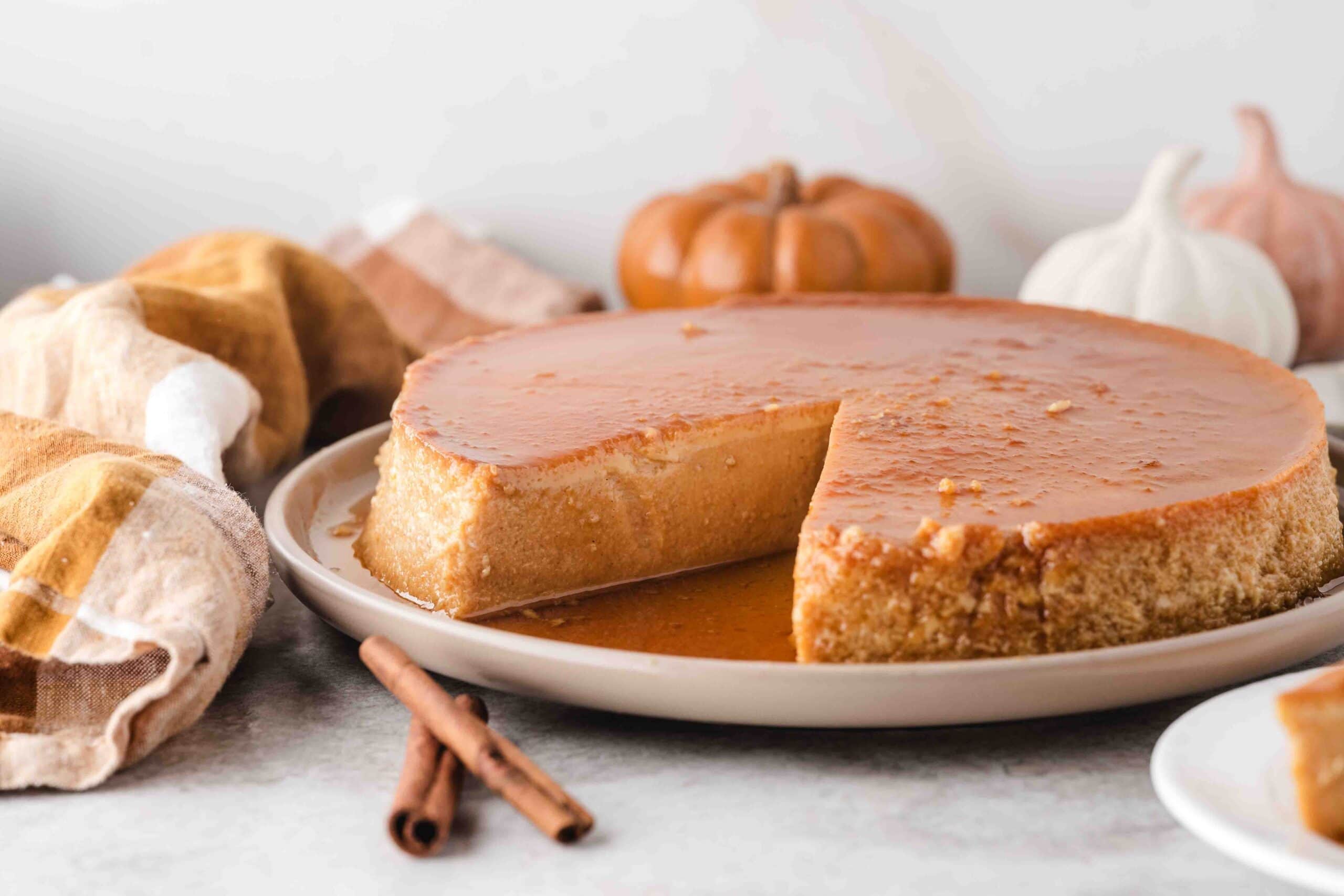 A slice has been cut from the pumpkin flan to show the tender inside