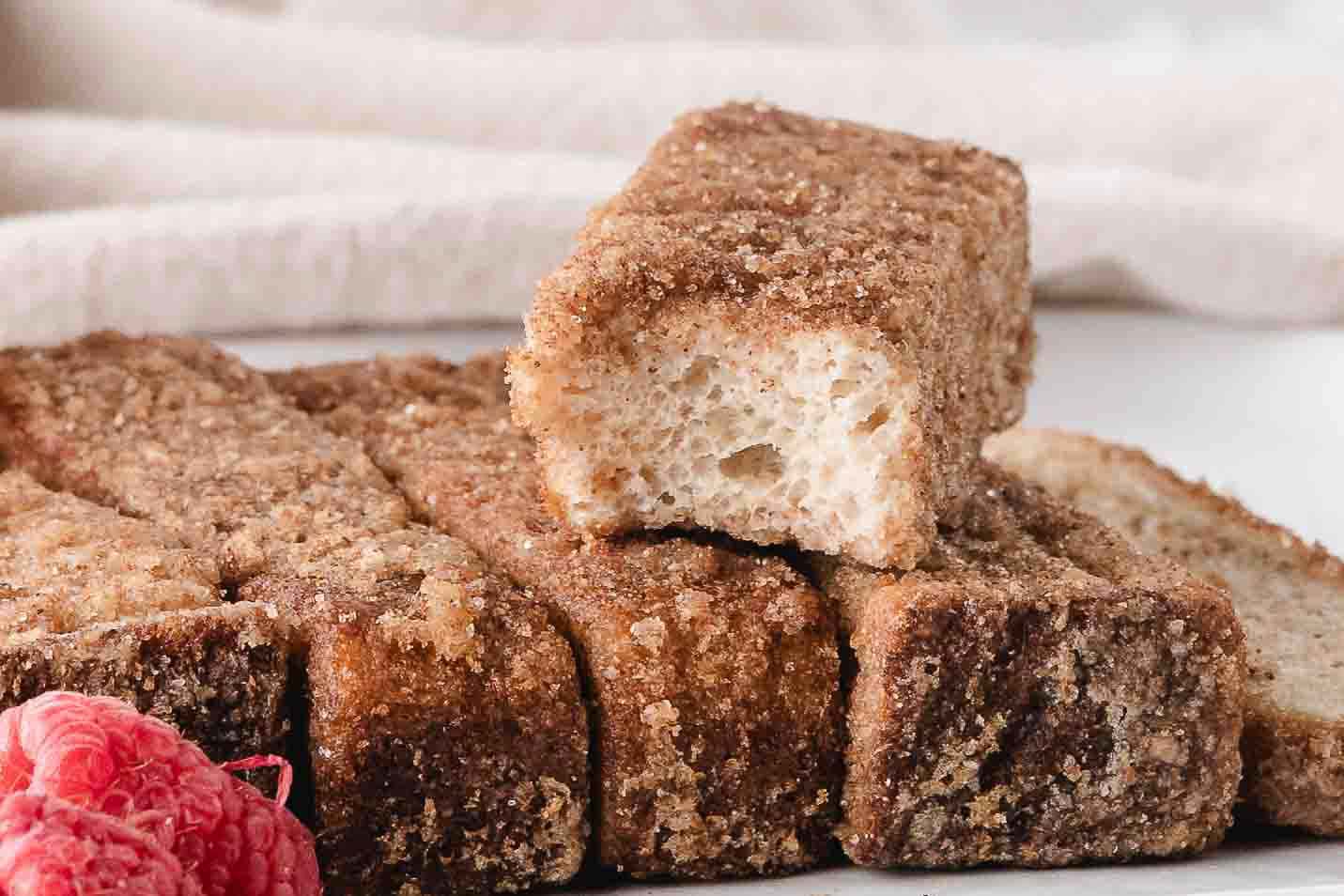 Air fryer french toast stick on a plate, piled up. Ready to be enjoyed