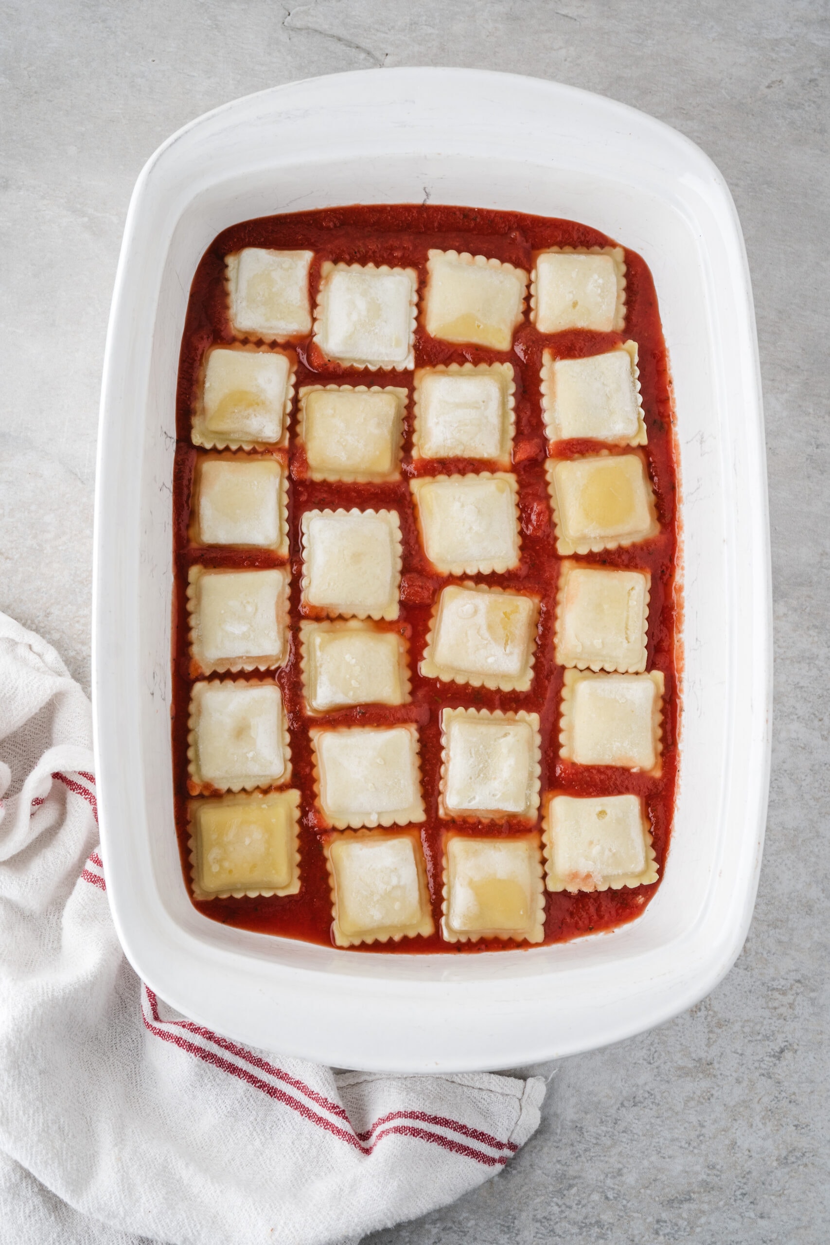 Process step of added ravioli to the sauce