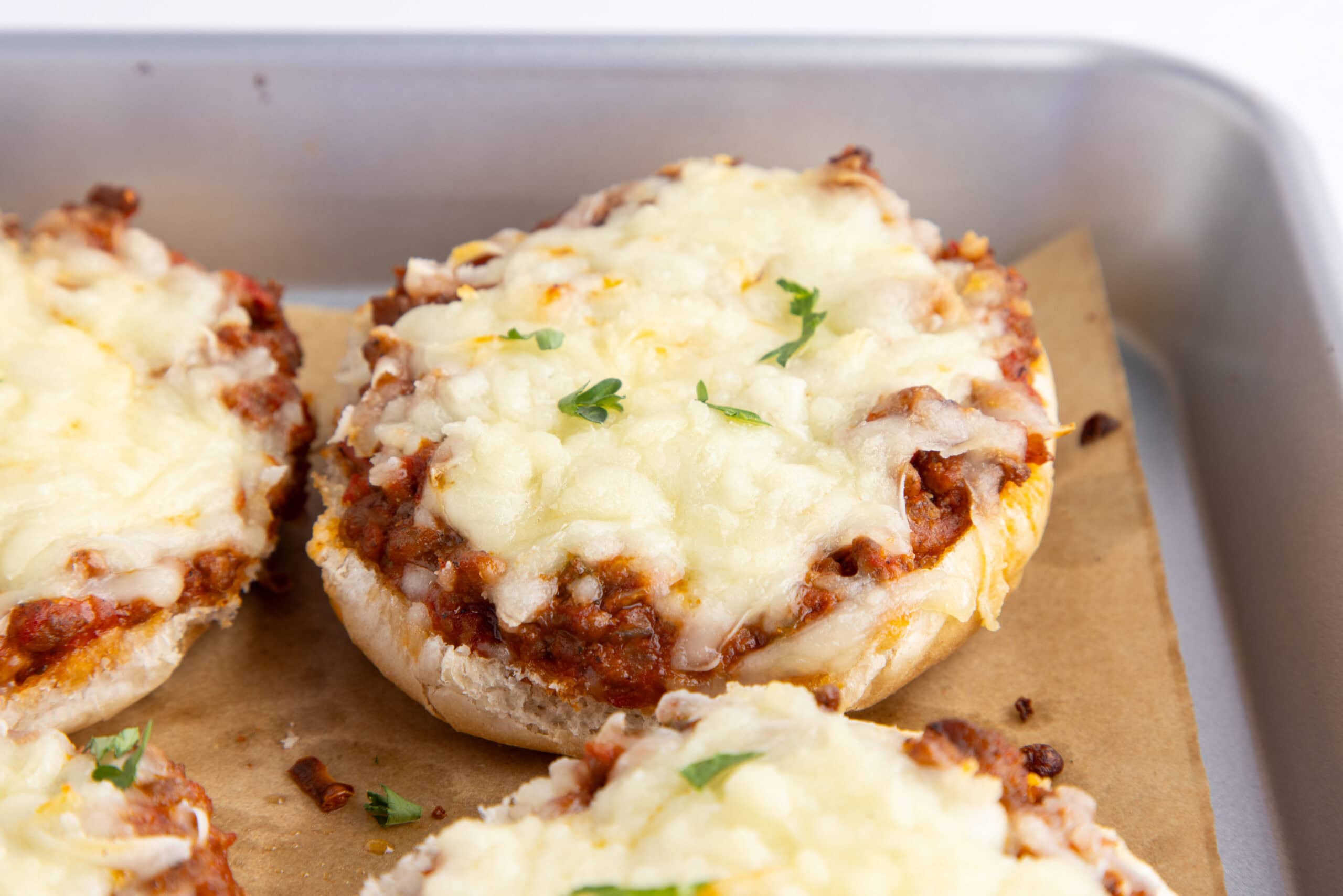 Pizza burgers all cooled from the oven after being baked, ready to be plated and enjoyed