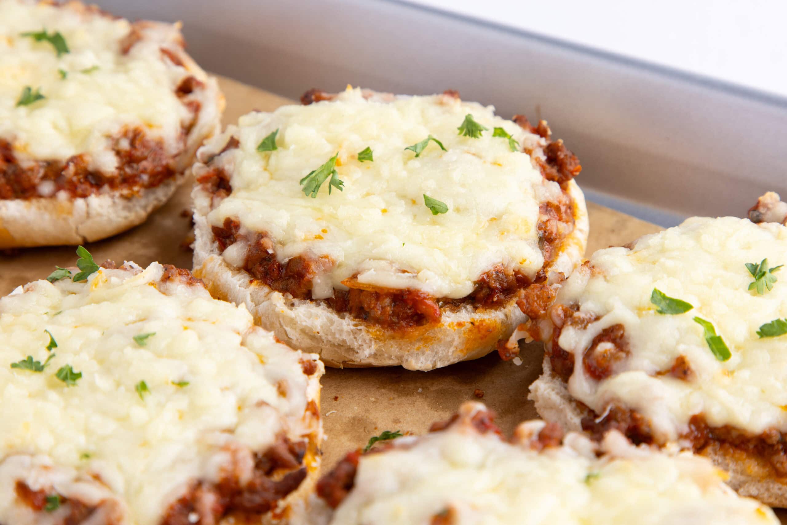 Finished pizza burgers plated and ready to be served