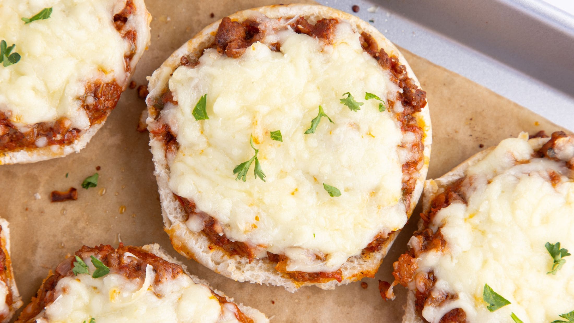 Close up of pizza burgers all baked and cooled, ready to be enjoyed