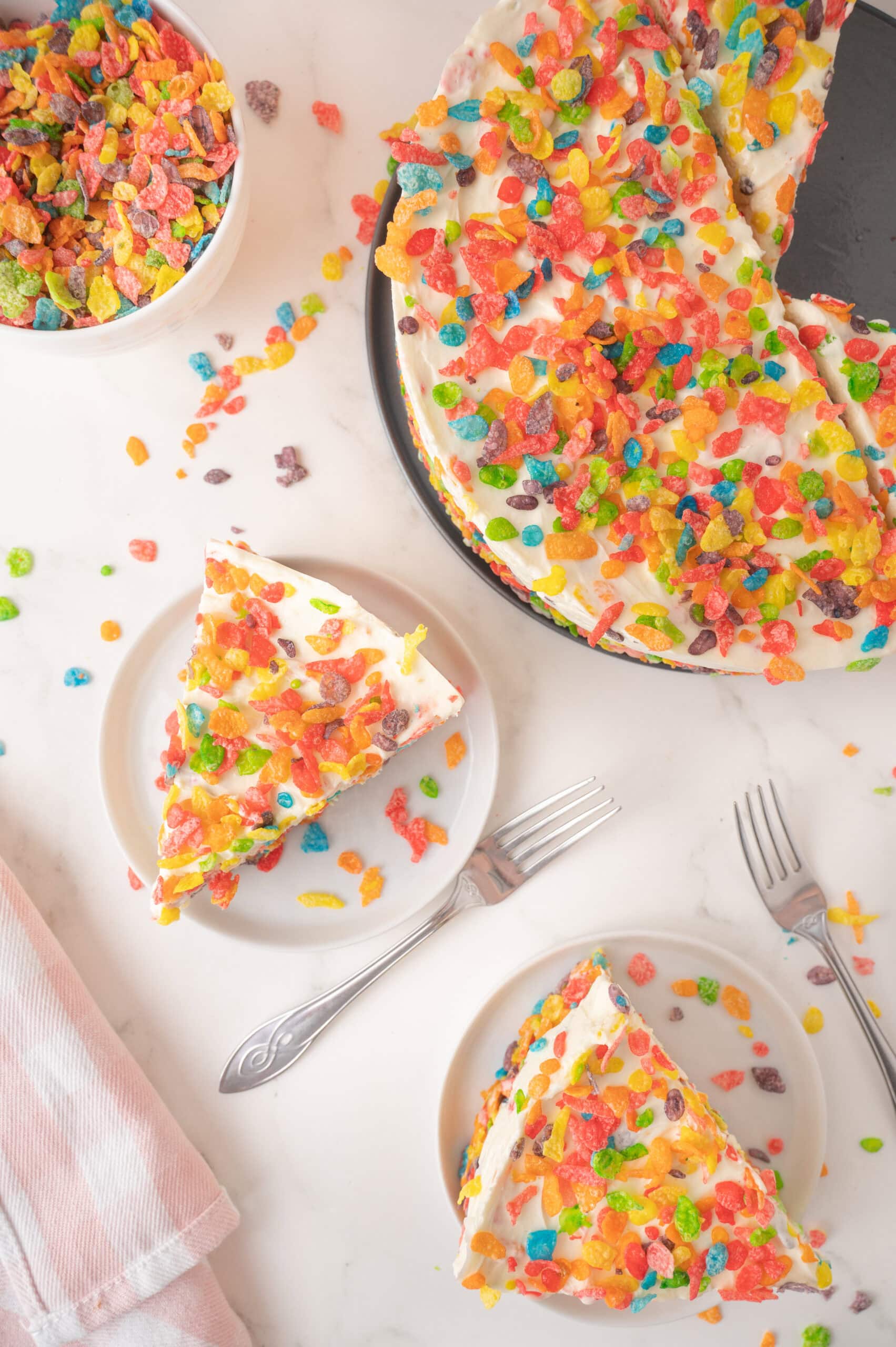 Plated 2 cheesecake slices with forks, ready to be enjoyed
