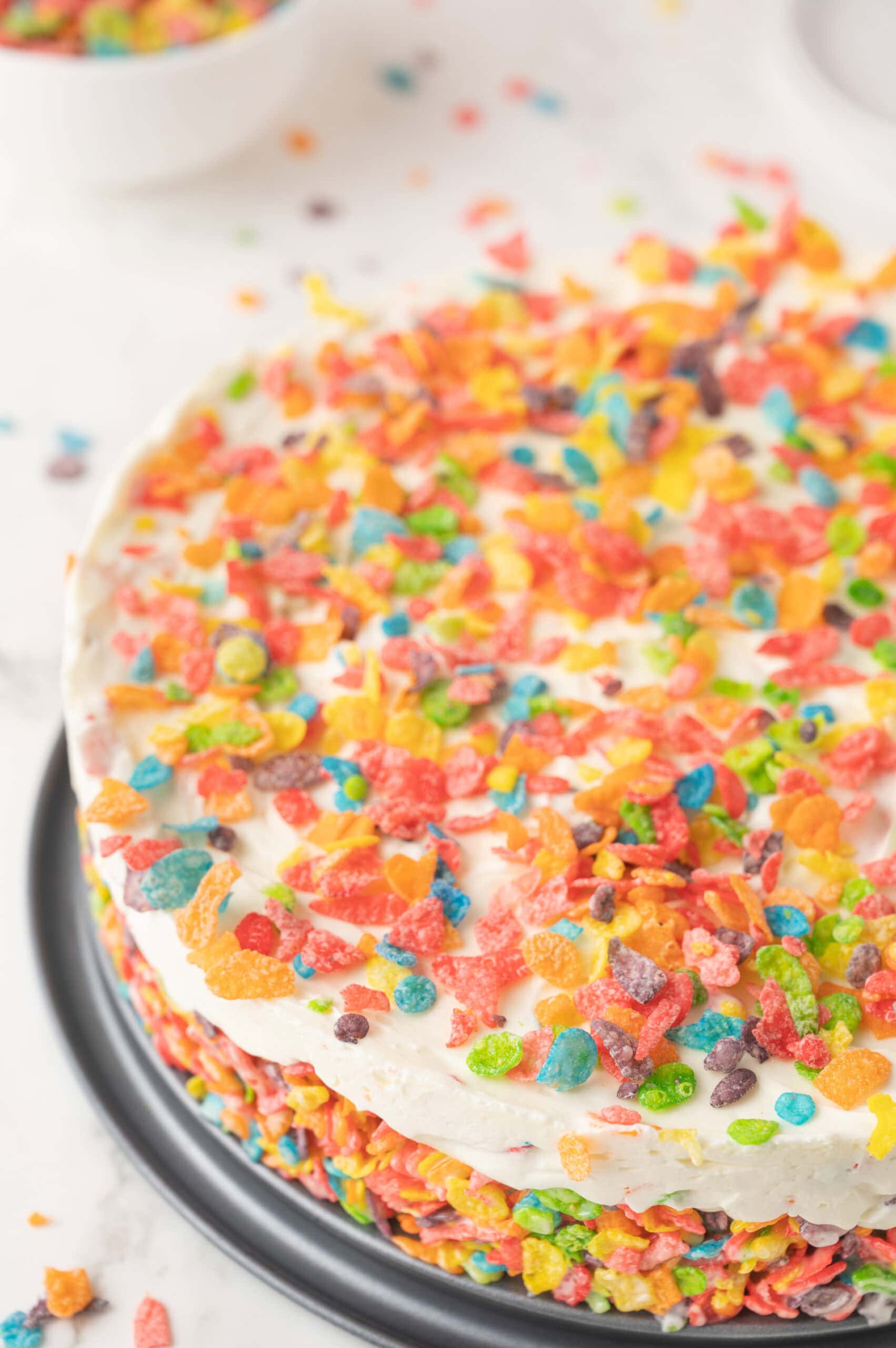Fruity Pebble cheesecake finished and ready to be cut to be enjoyed
