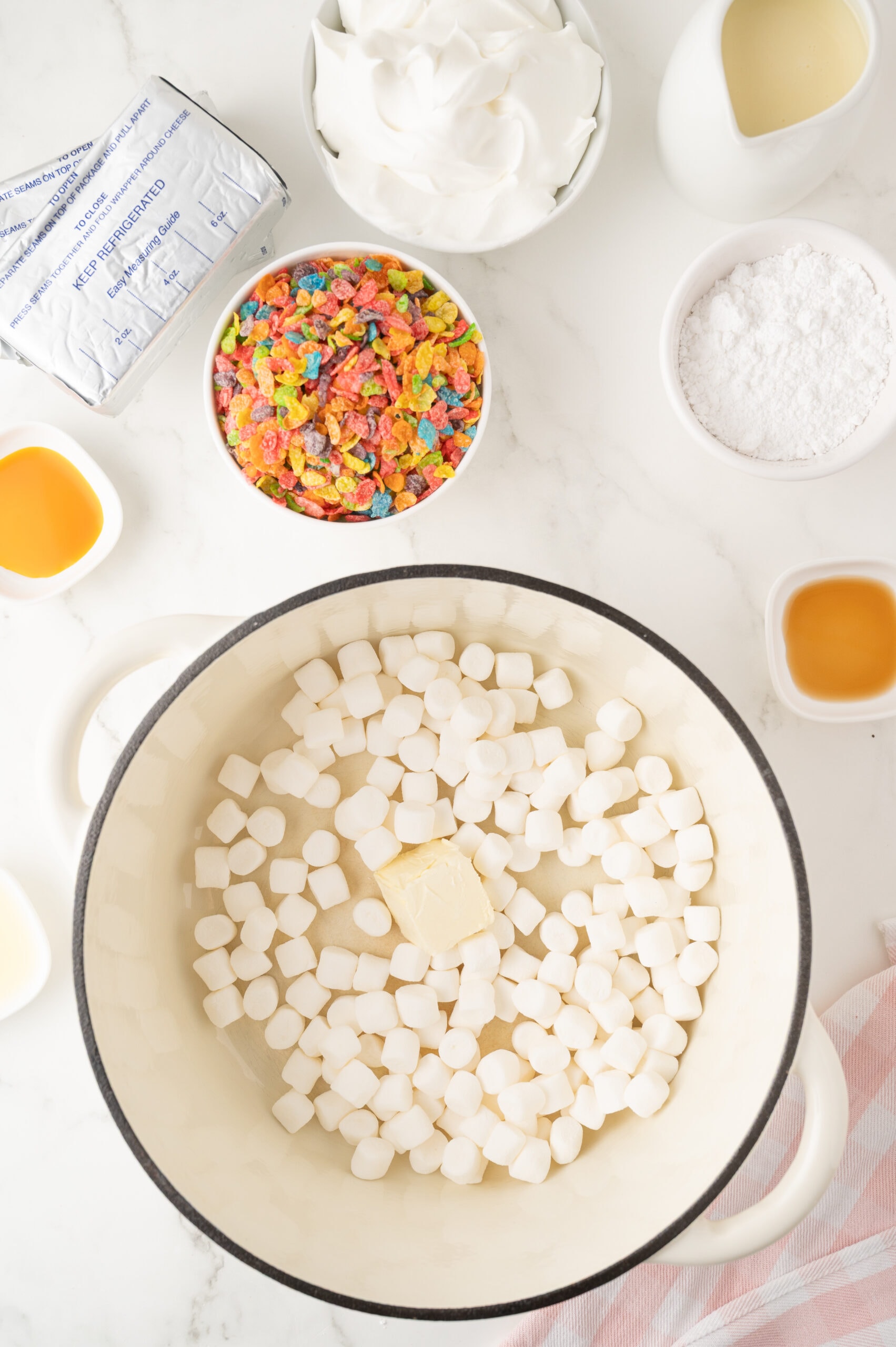 Marshmallows in pan to start the process of melting them to create the cheesecake, process step one