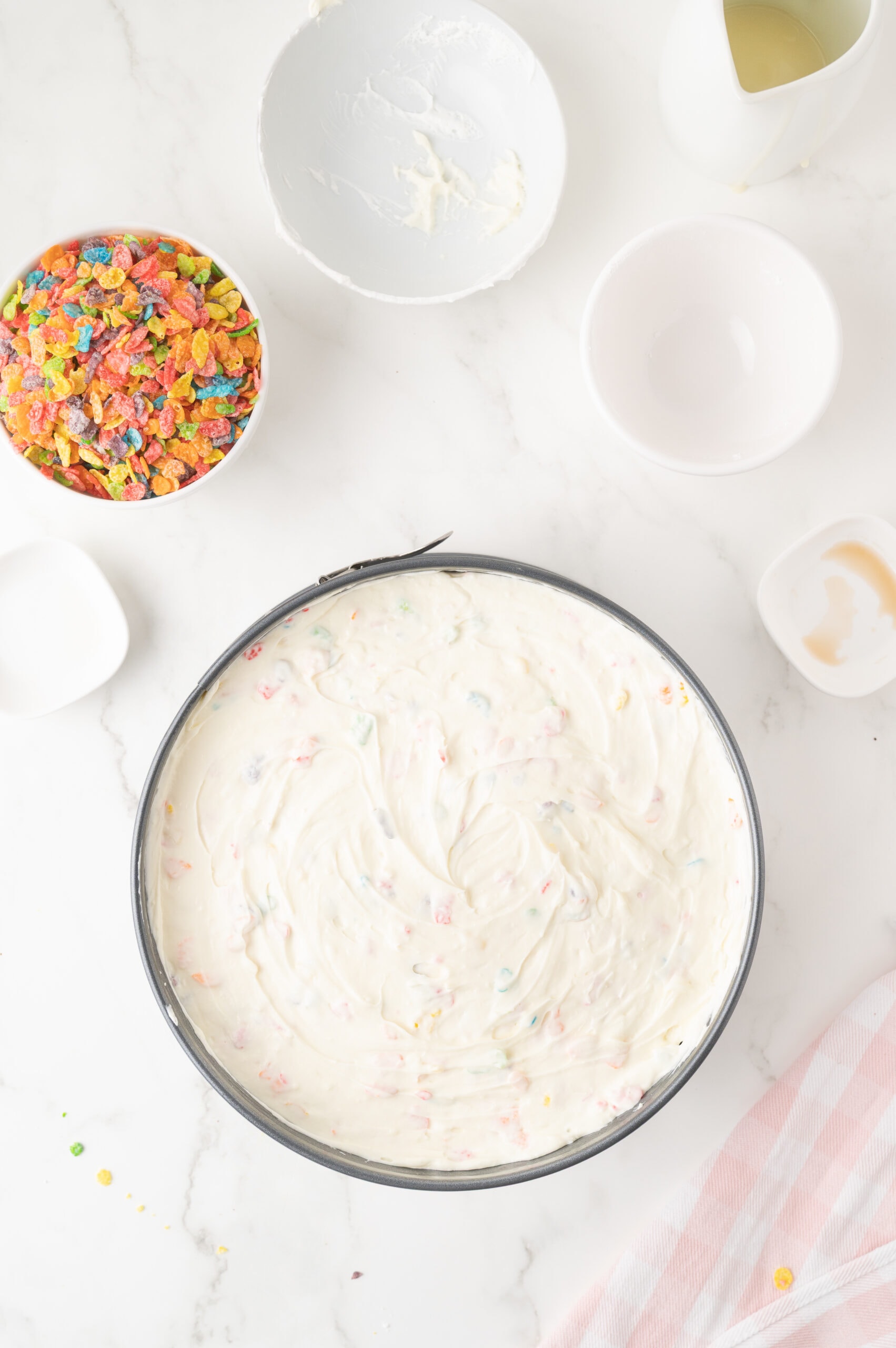 Ingredients: cream cheese, powdered sugar, extracts and lemojn juice in springform pan.