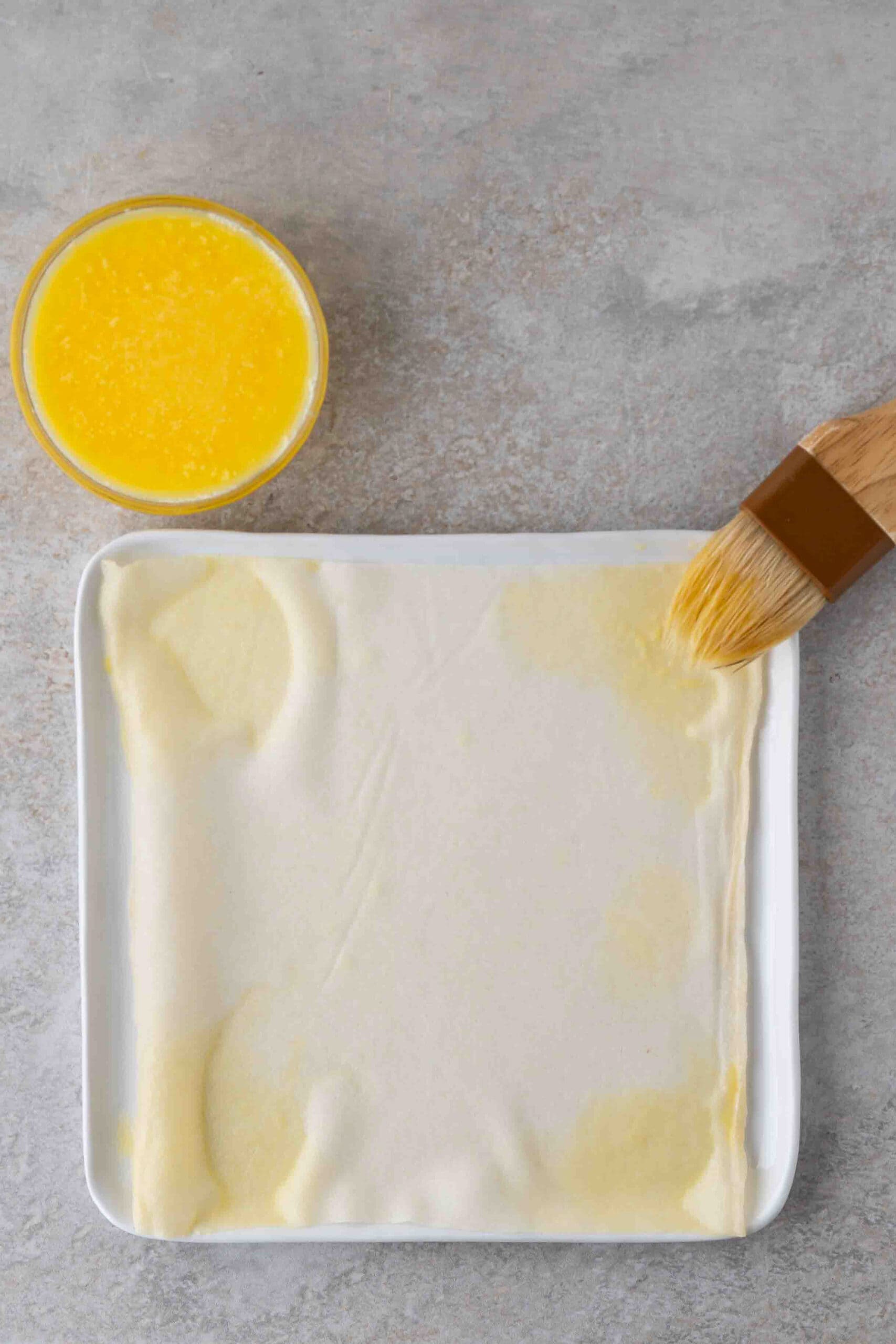 Egg wash on all four sides of the egg roll wrapper