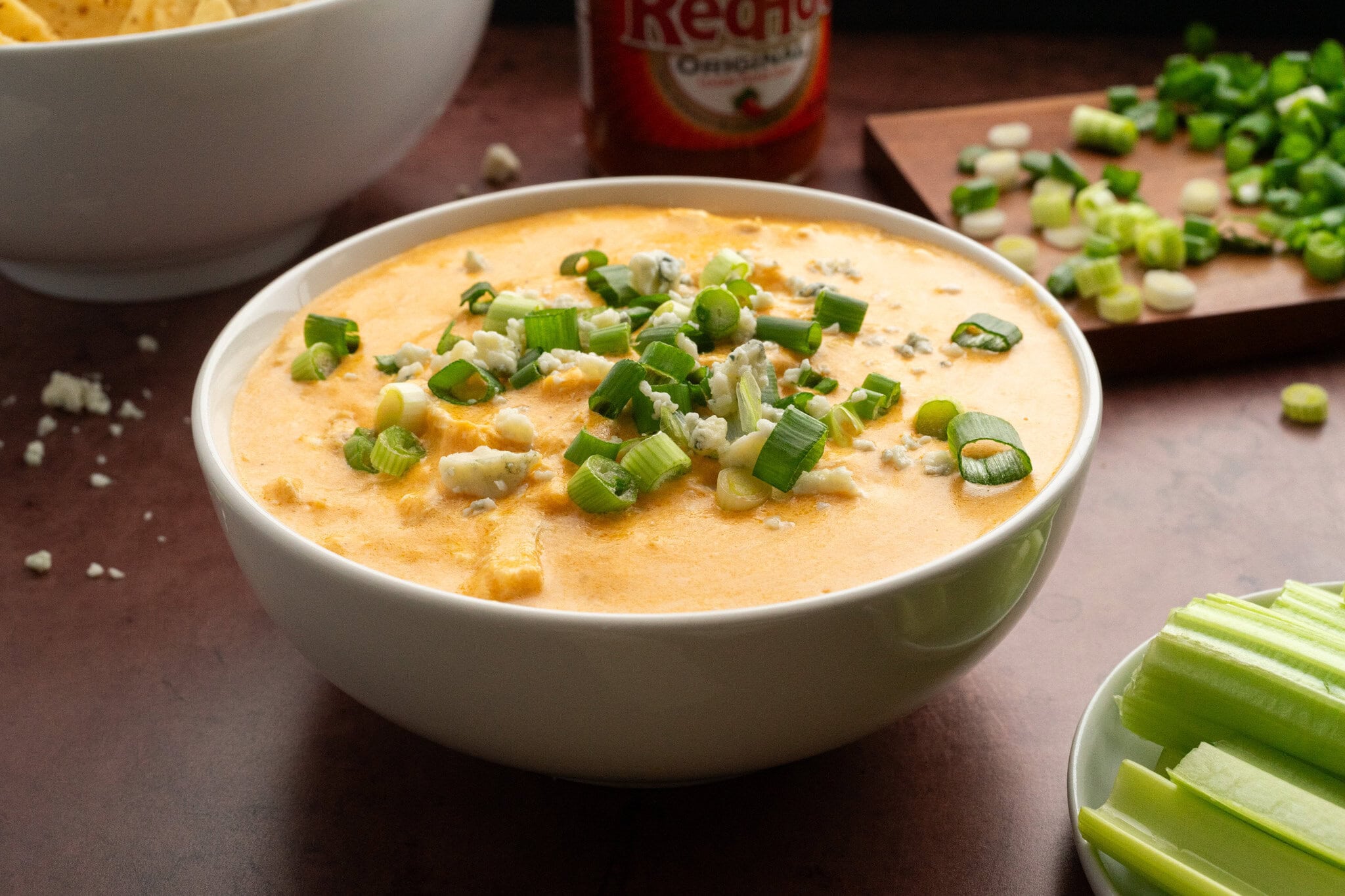 Buffalo chicken dip created homemade in the instant pot, served in a bowl, ready to be enjoyed
