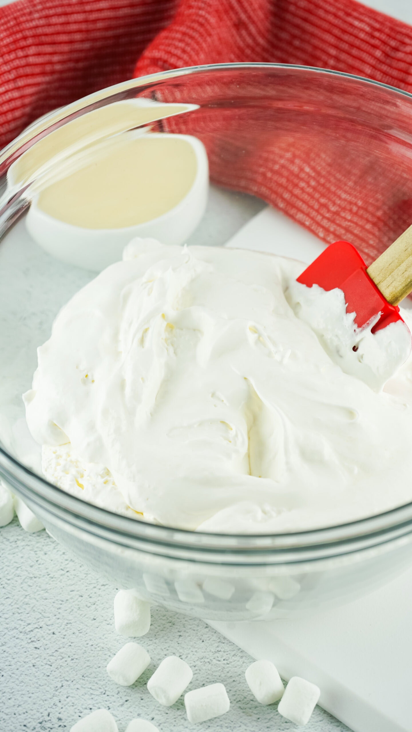 Starting the process of making cherry fluff by mixing whip cream