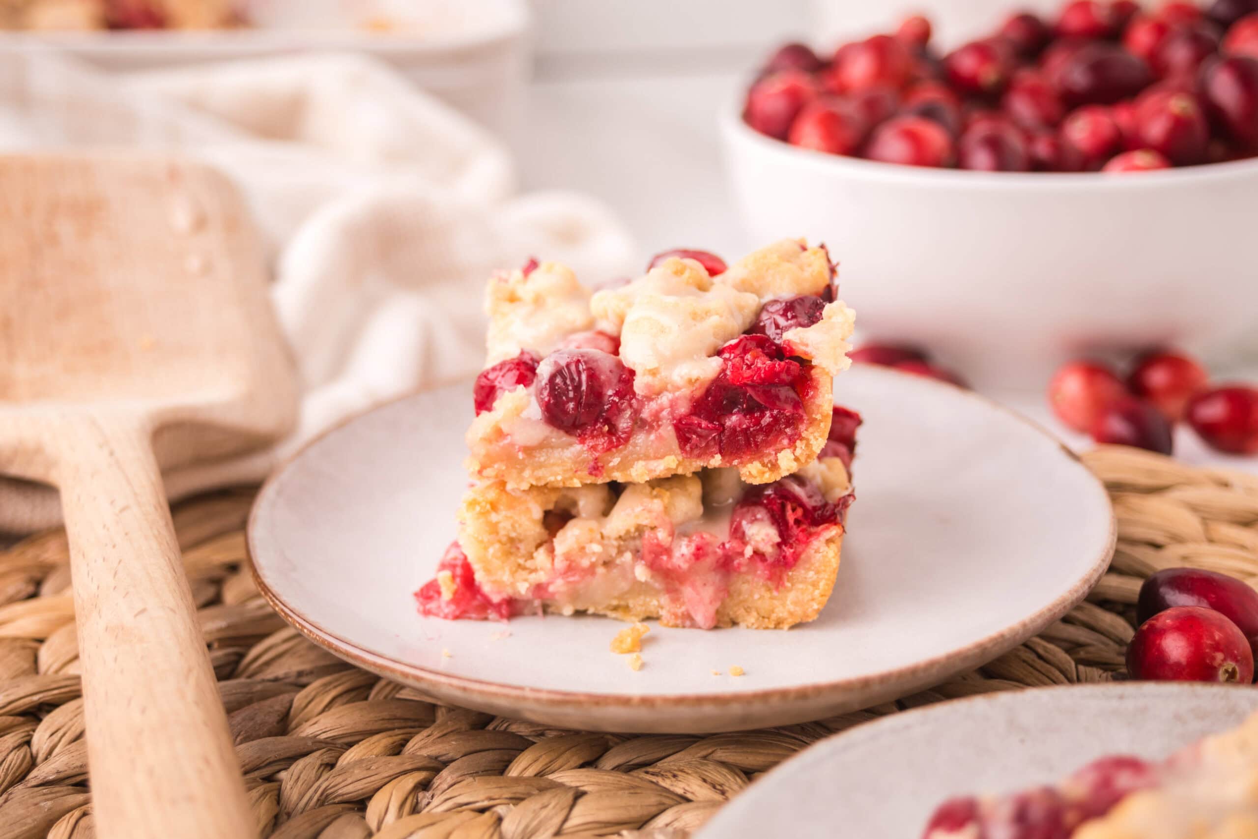 Wide angle shot of a stack of 2 cranberry bars, plated