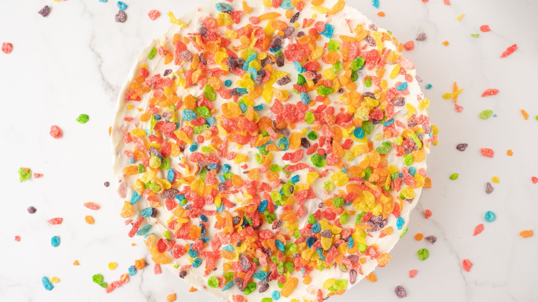 Fruity Pebble Cheesecake all ready to be sliced and enjoyed