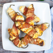 Air fried jalapeno poppers all on a plate, piled high ready to be enjoyed