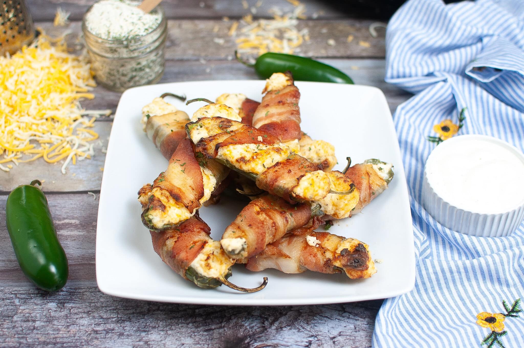 Plated jalapeno poppers all cooked and cooled ready to be enjoyed